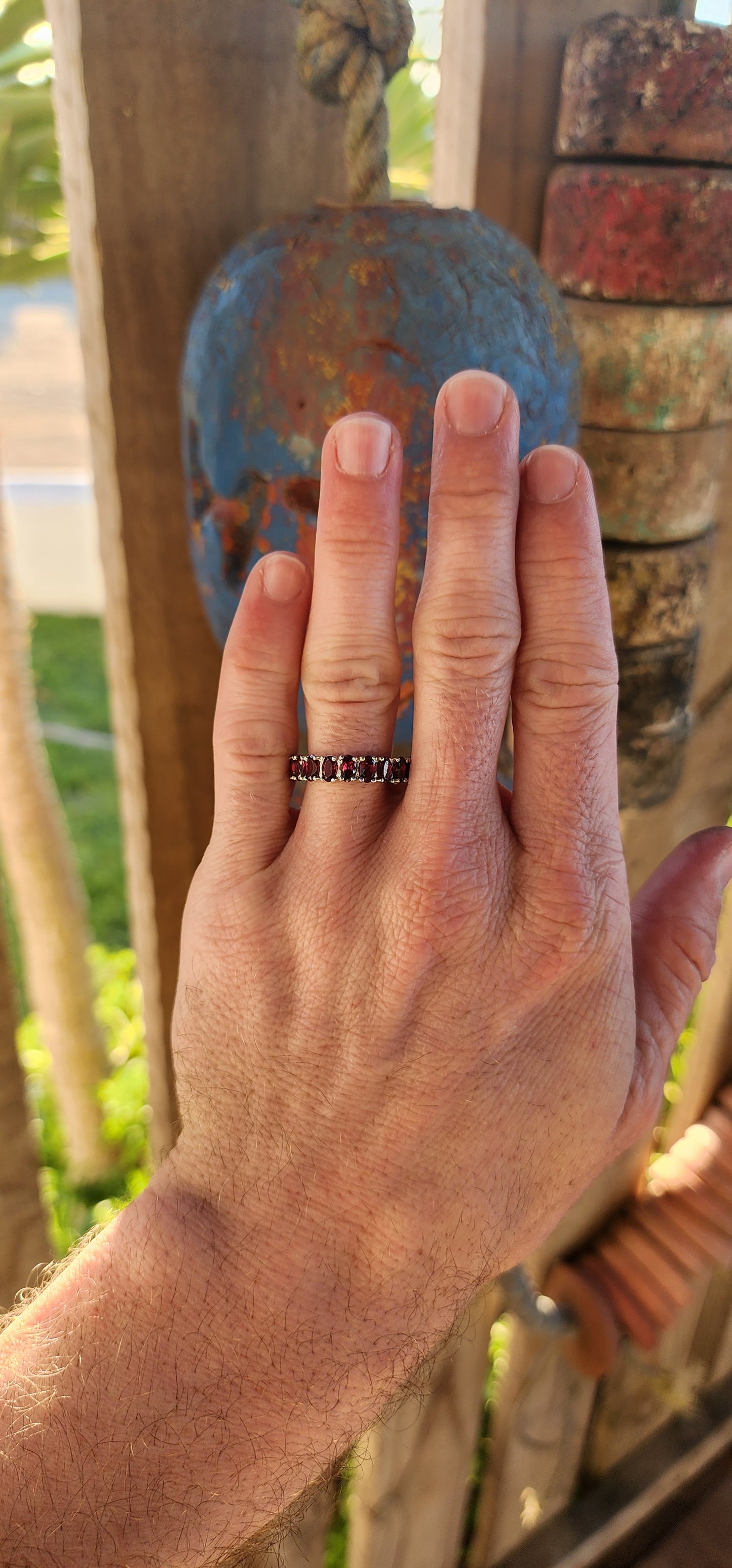This sterling silver full eternity ring is a dazzling display of deep, rich purple rhodolite garnets, meticulously claw-set in an endless circle of brilliance.