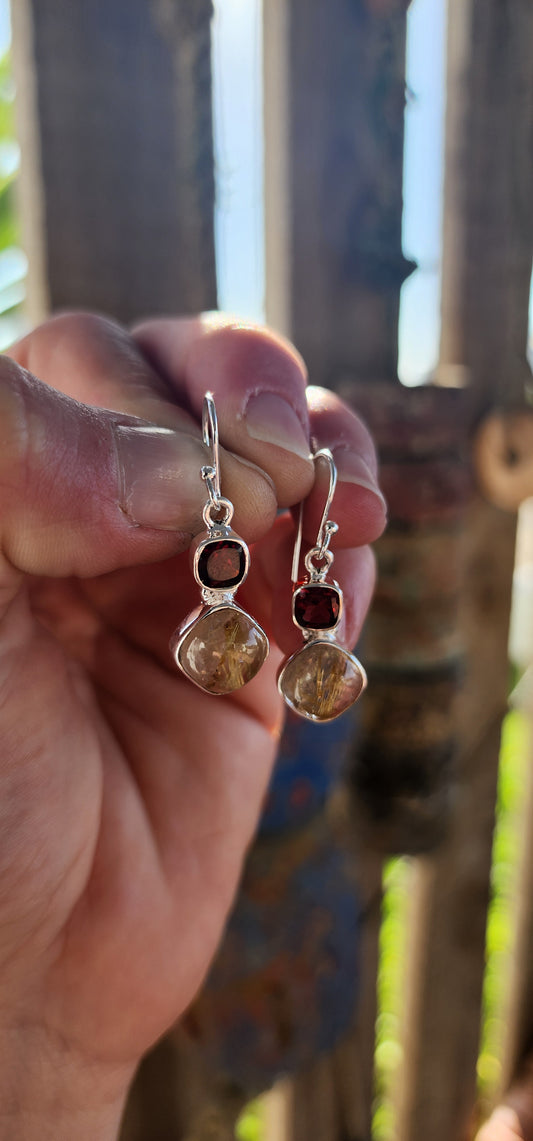 These sterling silver drop earrings are the perfect fusion of fire and earth, a mesmerizing dance between passion and mystique.