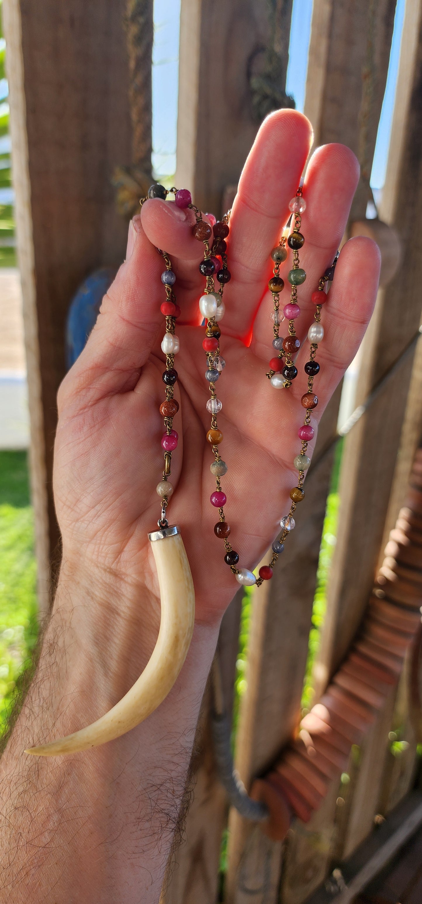 This large pre-ban ivory and sterling silver tusk pendant necklace is an absolute showstopper—bold, eclectic, and steeped in history. It’s the kind of piece that effortlessly blends tribal elegance, bohemian flair, and artisanal craftsmanship.