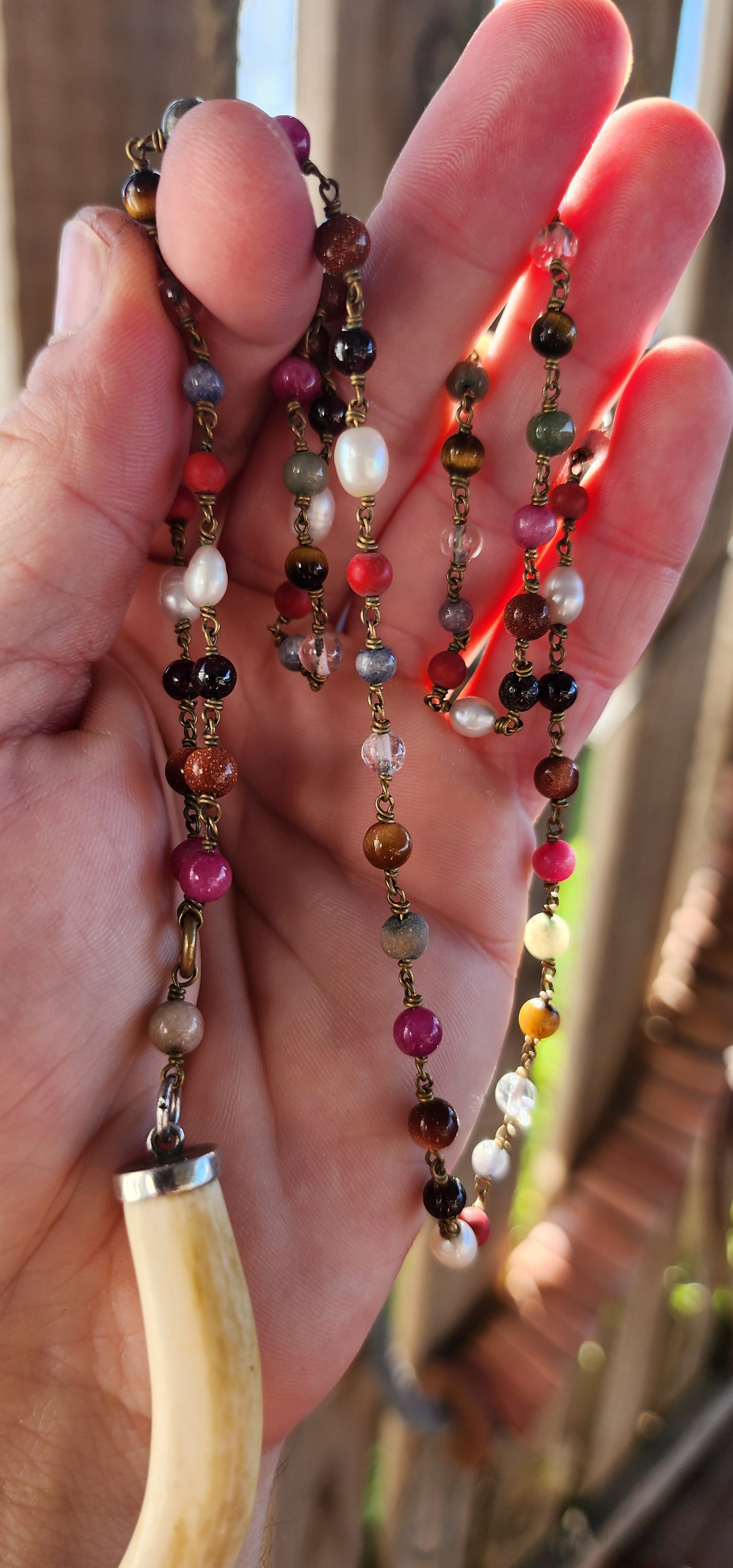 This large pre-ban ivory and sterling silver tusk pendant necklace is an absolute showstopper—bold, eclectic, and steeped in history. It’s the kind of piece that effortlessly blends tribal elegance, bohemian flair, and artisanal craftsmanship.