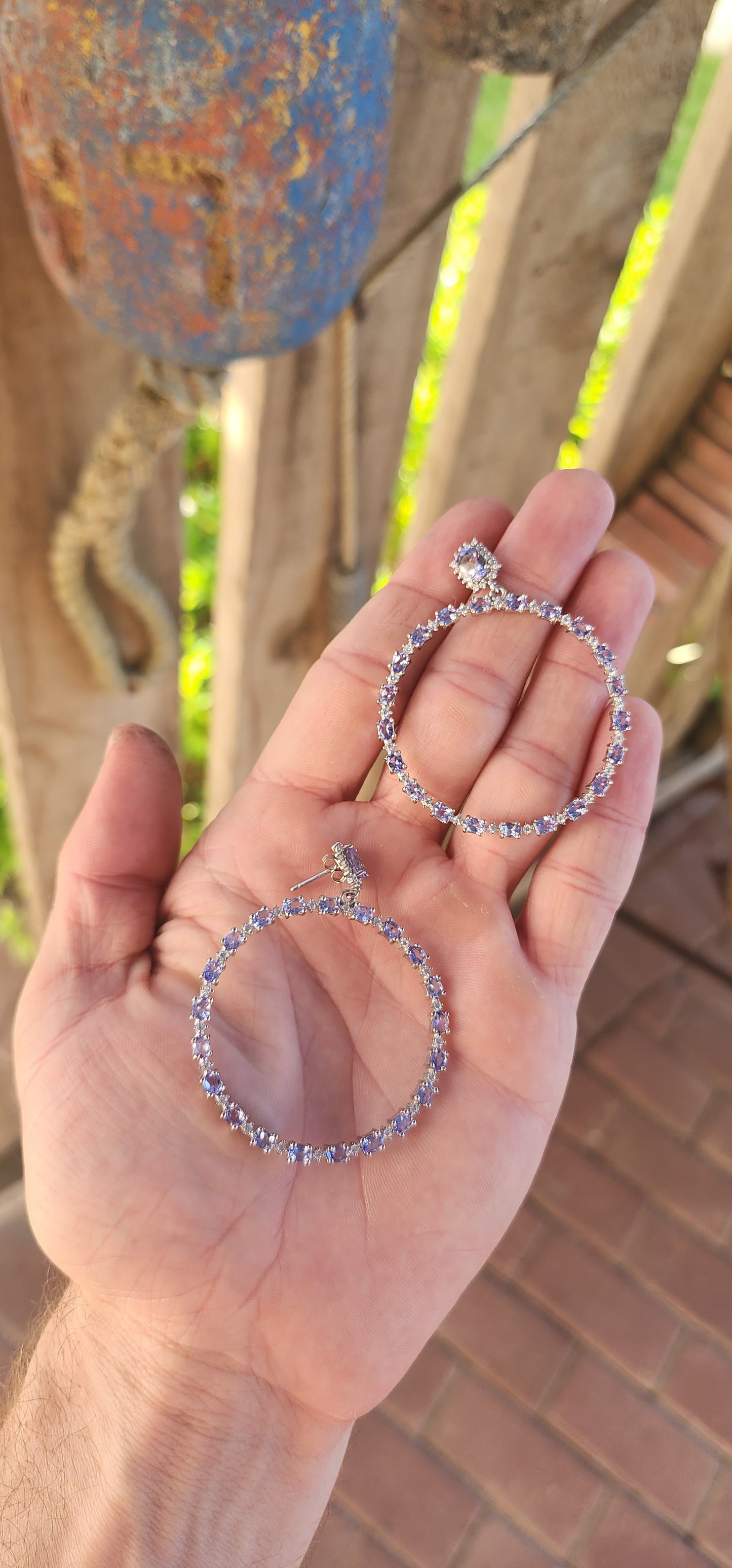 These breathtaking STATEMENT earrings are an exquisite display of refined elegance and meticulous craftsmanship, designed to captivate with their radiant sparkle and bold yet graceful presence.
