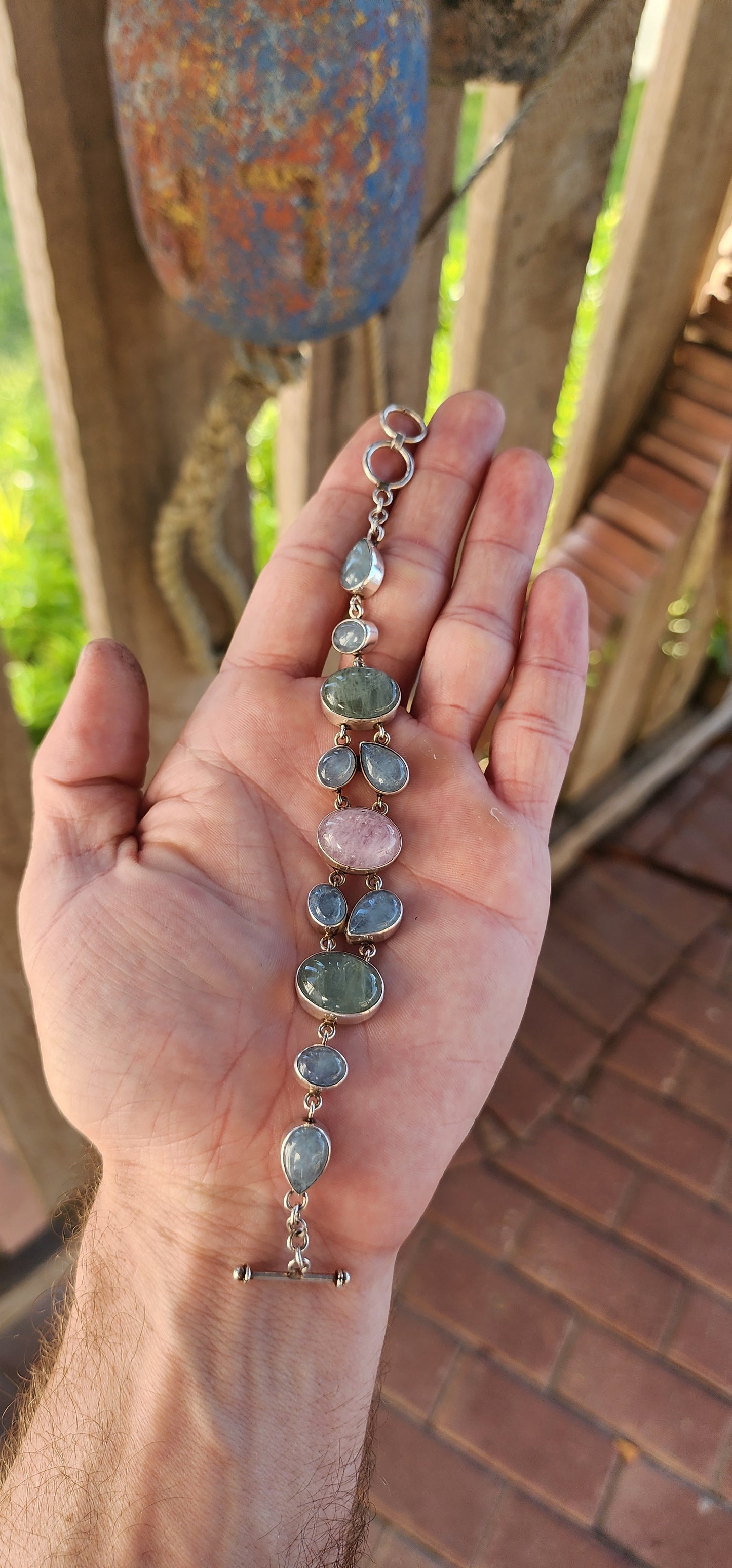 This bracelet is an absolute dream in pastel hues, a soft and elegant piece that blends delicate charm with artisanal craftsmanship.