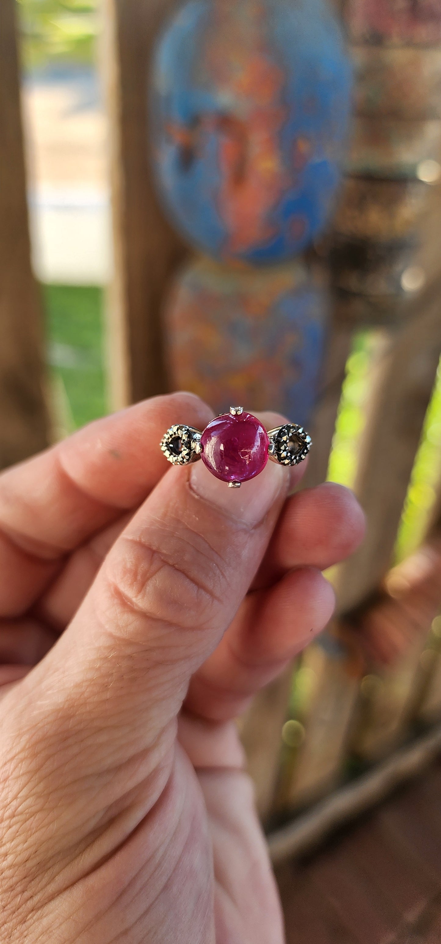 The Enchanted Rose" – A Ring of Timeless Elegance.
This sterling silver and rubellite tourmaline cabochon solitaire ring, affectionately named "The Enchanted Rose," is a spellbinding creation, whispering tales of romance, mystery, and celestial beauty.