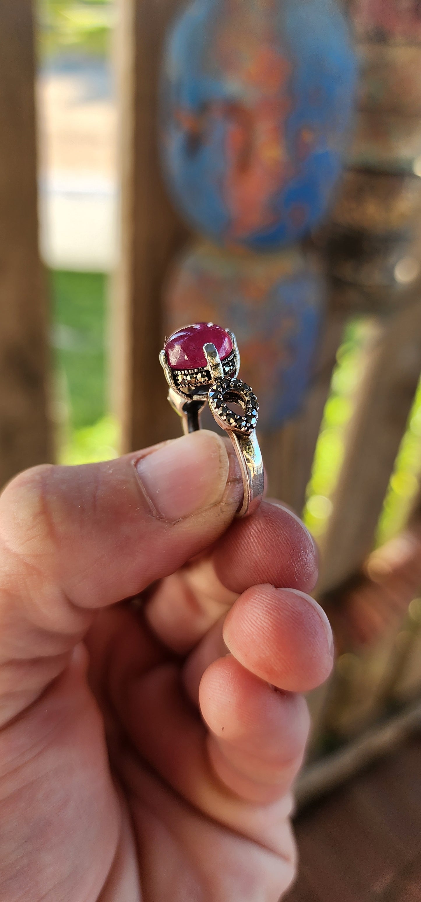 The Enchanted Rose" – A Ring of Timeless Elegance.
This sterling silver and rubellite tourmaline cabochon solitaire ring, affectionately named "The Enchanted Rose," is a spellbinding creation, whispering tales of romance, mystery, and celestial beauty.