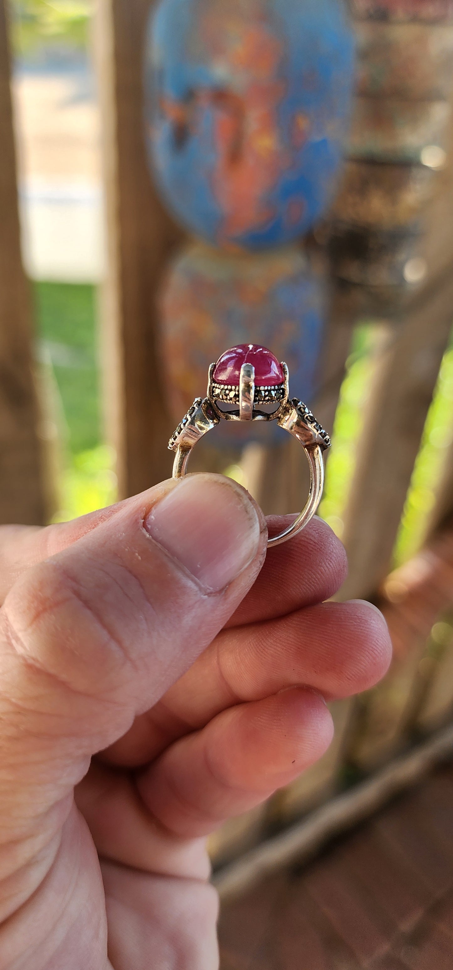 The Enchanted Rose" – A Ring of Timeless Elegance.
This sterling silver and rubellite tourmaline cabochon solitaire ring, affectionately named "The Enchanted Rose," is a spellbinding creation, whispering tales of romance, mystery, and celestial beauty.