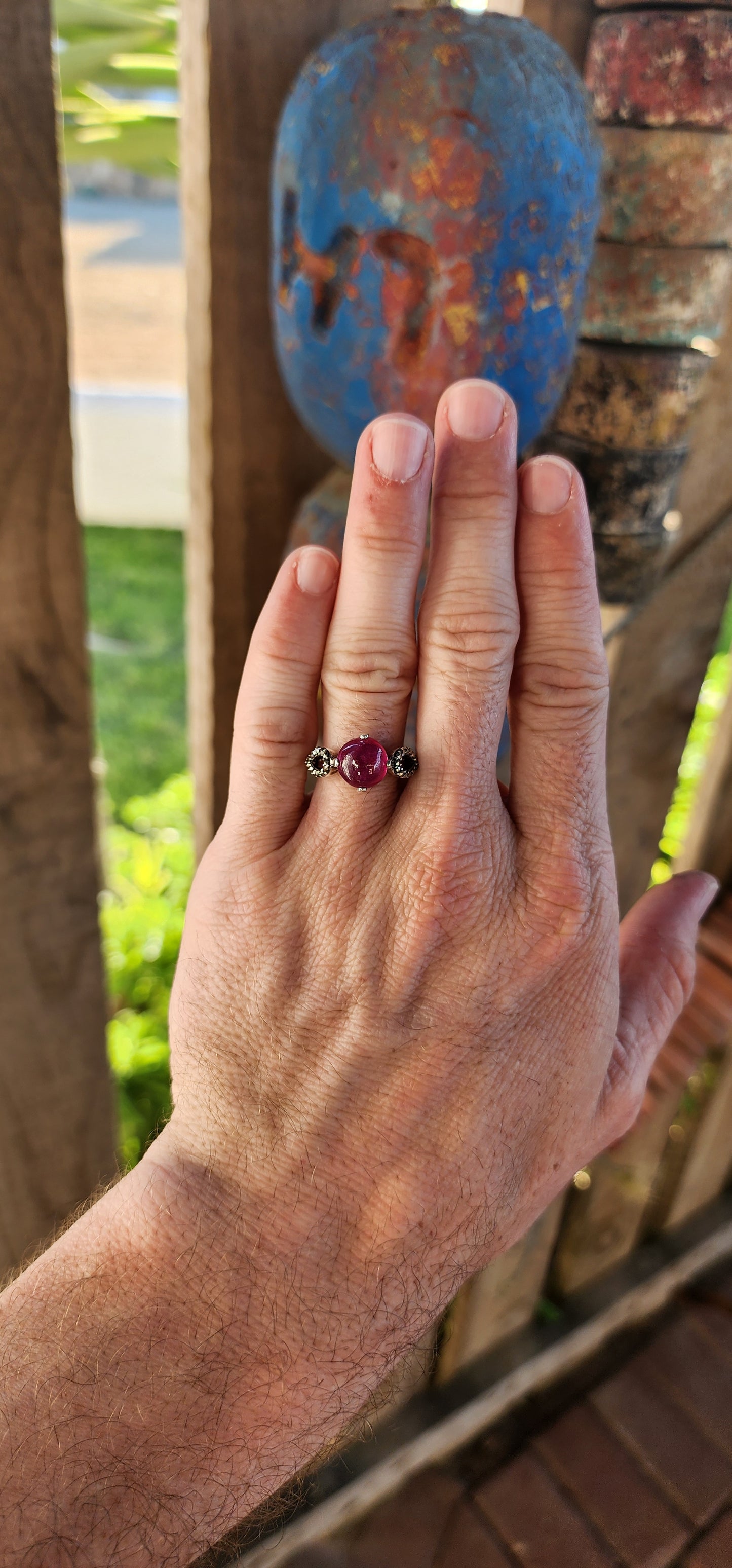 The Enchanted Rose" – A Ring of Timeless Elegance.
This sterling silver and rubellite tourmaline cabochon solitaire ring, affectionately named "The Enchanted Rose," is a spellbinding creation, whispering tales of romance, mystery, and celestial beauty.