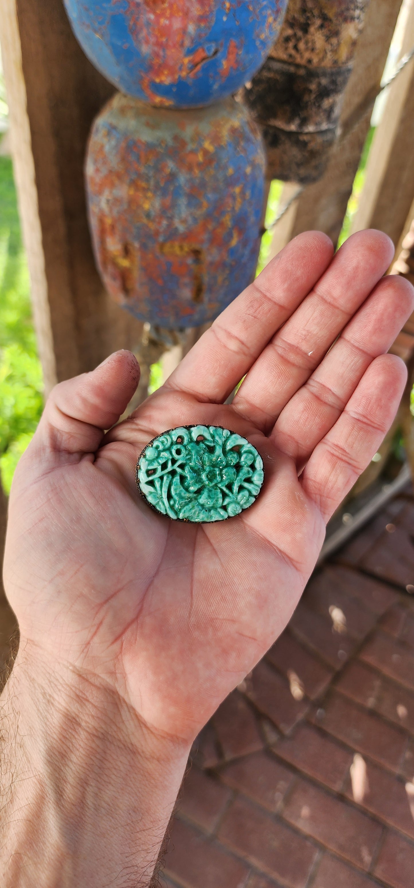 This circa 1920's Art Deco Czech costume brooch is a breathtaking piece that encapsulates the luxurious artistry of Bohemian glass jewelry, particularly the famed Peking glass tradition.