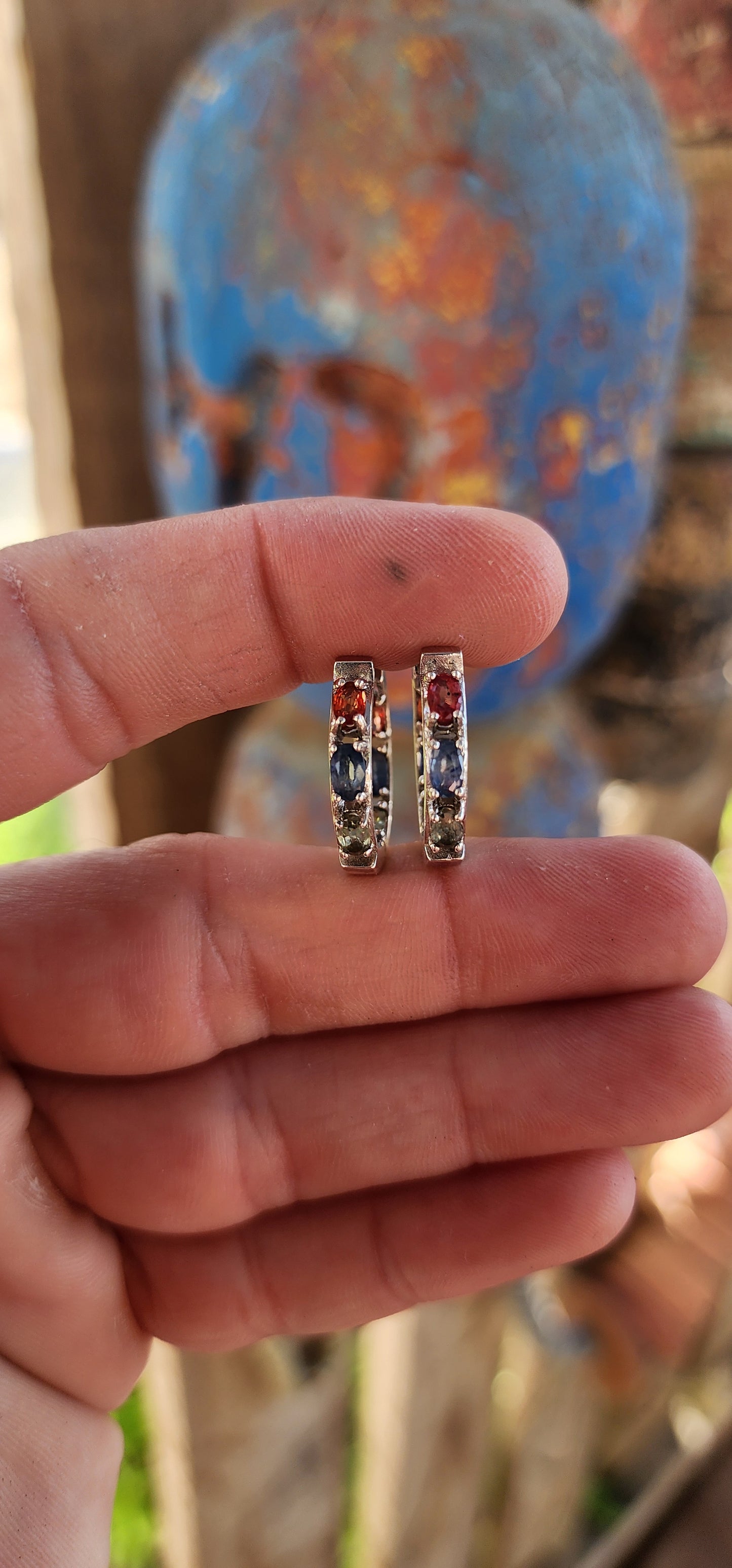 These sterling silver and multicolor sapphire huggie hoop earrings are absolutely breathtaking!
These elegant huggies are crafted in sterling silver, forming a seamless circular design that gently hugs the earlobe.