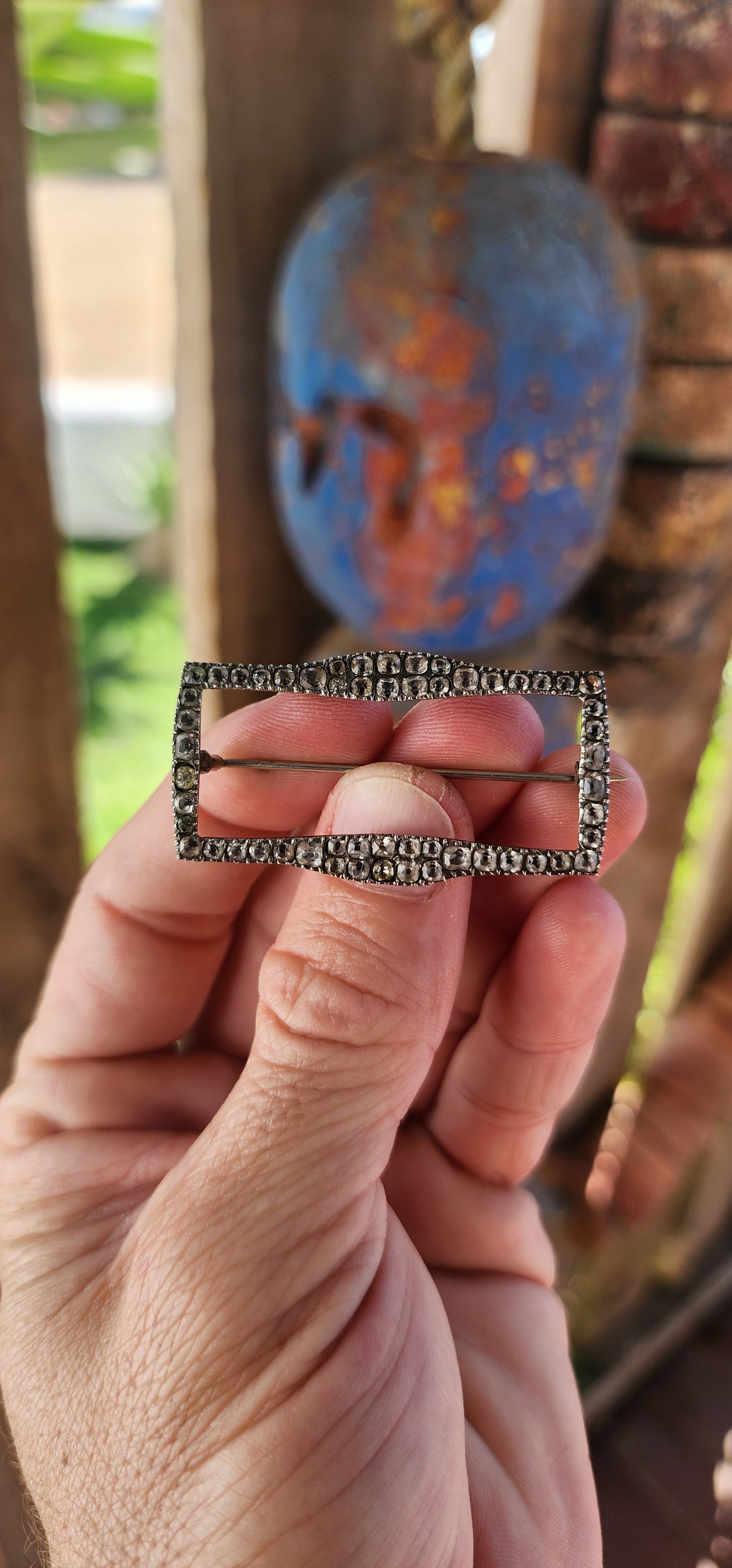 This is a scarce early Victorian sterling silver and black dot paste shoe buckle, which has been repurposed as a brooch.