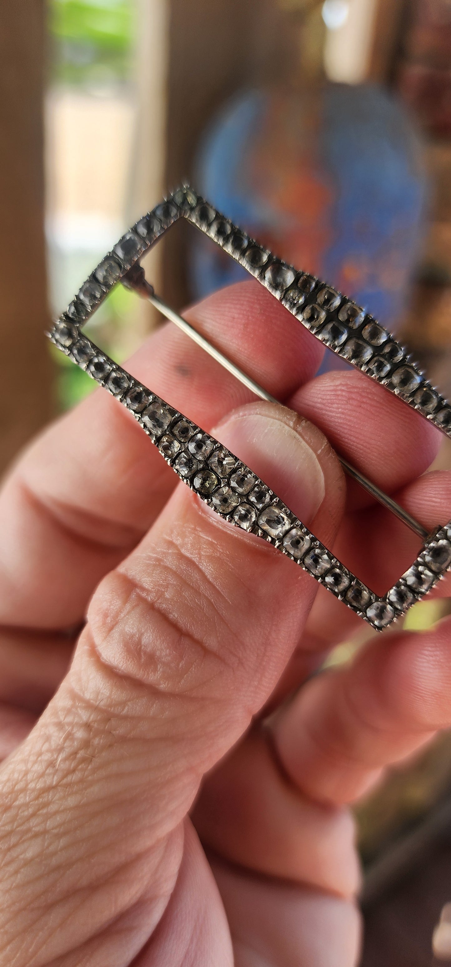 This is a scarce early Victorian sterling silver and black dot paste shoe buckle, which has been repurposed as a brooch.