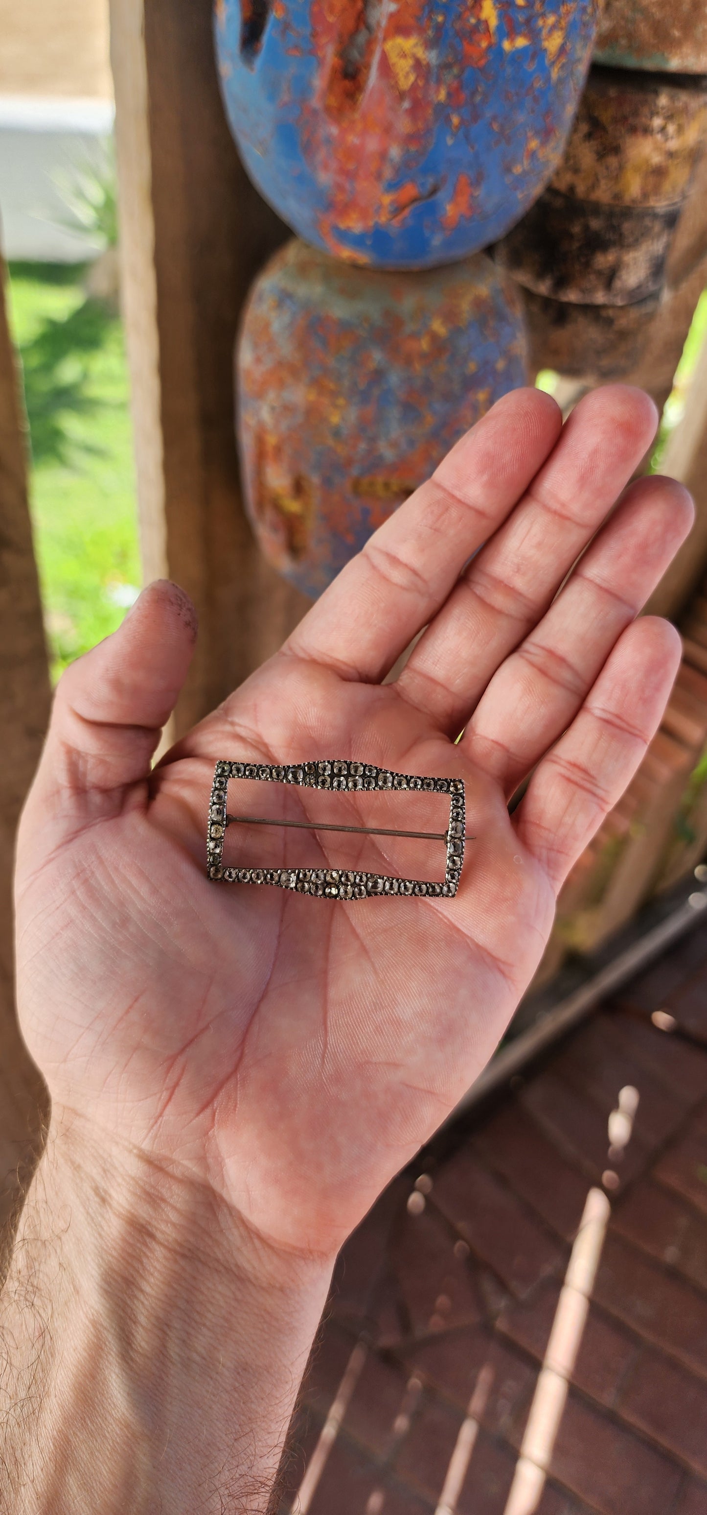 This is a scarce early Victorian sterling silver and black dot paste shoe buckle, which has been repurposed as a brooch.