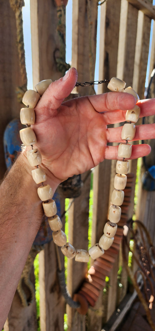 Meet your new statement-maker! This bold and earthy necklace features chunky barrel-shaped bamboo coral beads in a soft creamy white hue, each one unique with its own natural grooves and character.