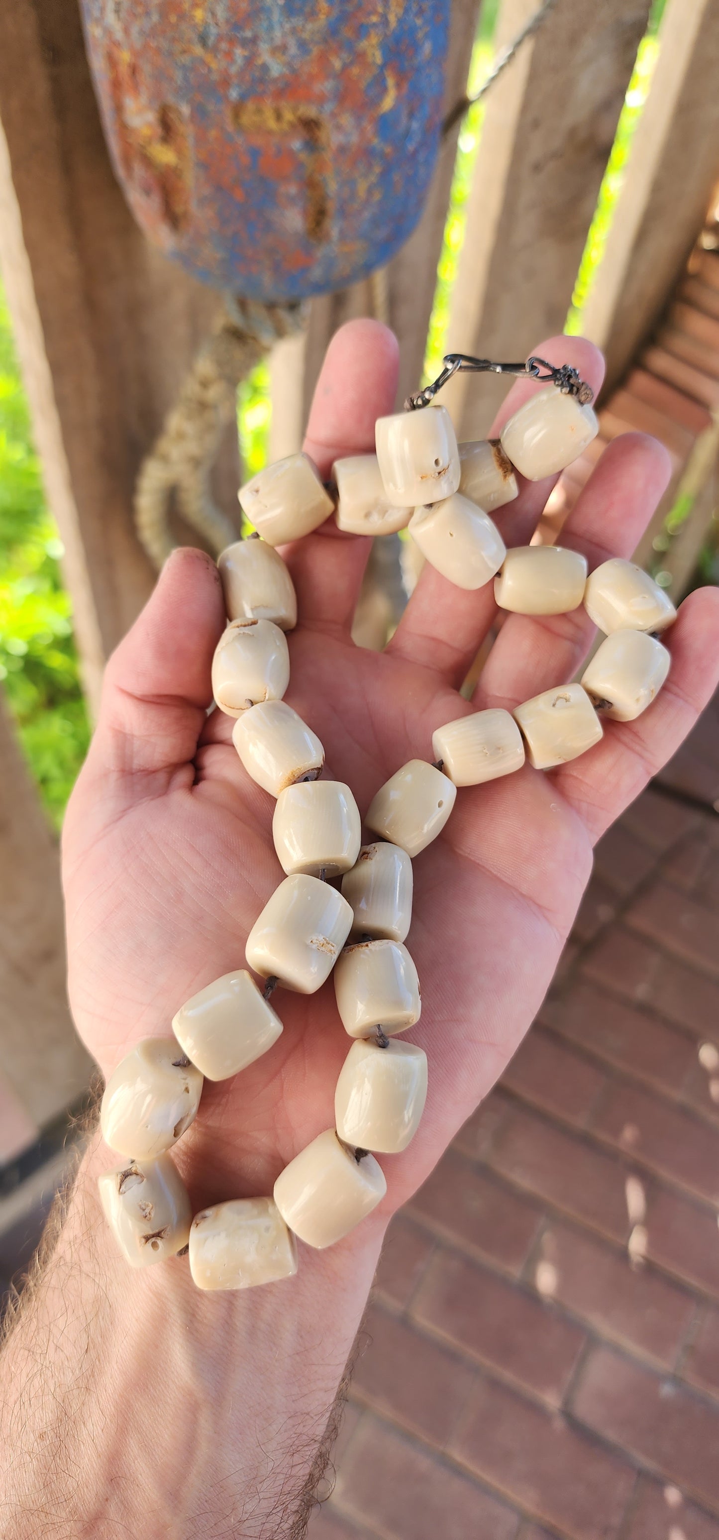 Meet your new statement-maker! This bold and earthy necklace features chunky barrel-shaped bamboo coral beads in a soft creamy white hue, each one unique with its own natural grooves and character.