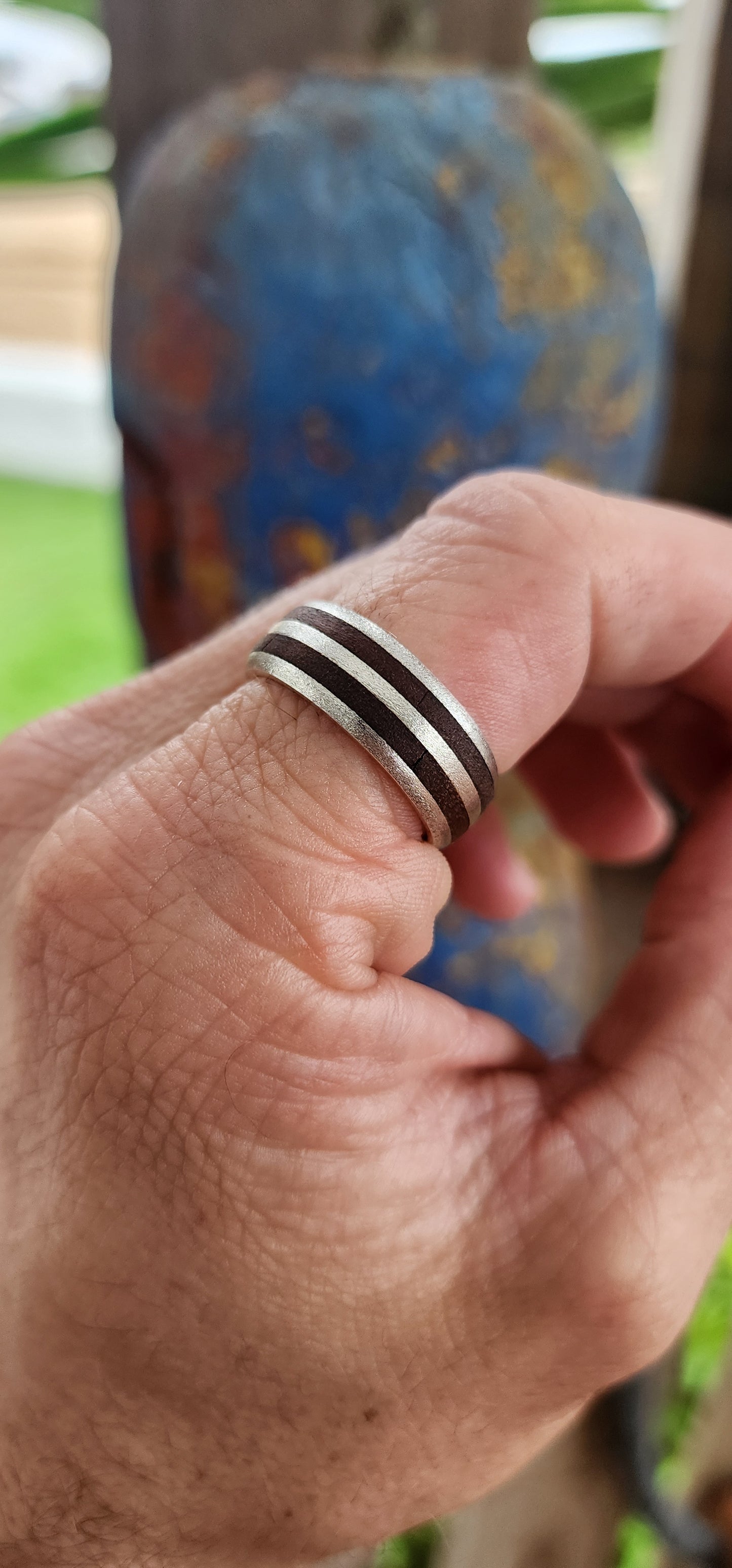 The Double Barrel Outlaw Ring.
This one’s got serious attitude! A chunky, battle-ready band, this ring fuses rustic charm with rugged steel in perfect harmony.
