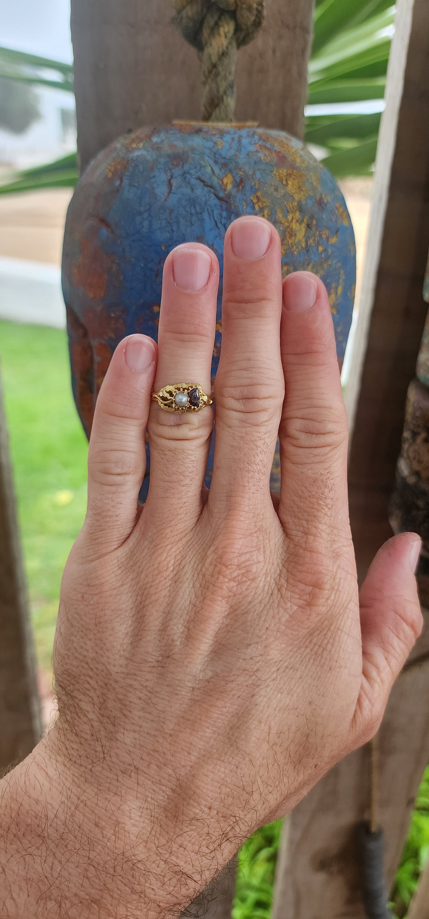 This is a marvelous and rare example of late Georgian to early Victorian mourning jewelry, specifically a mourning ring crafted in 15-carat yellow gold.