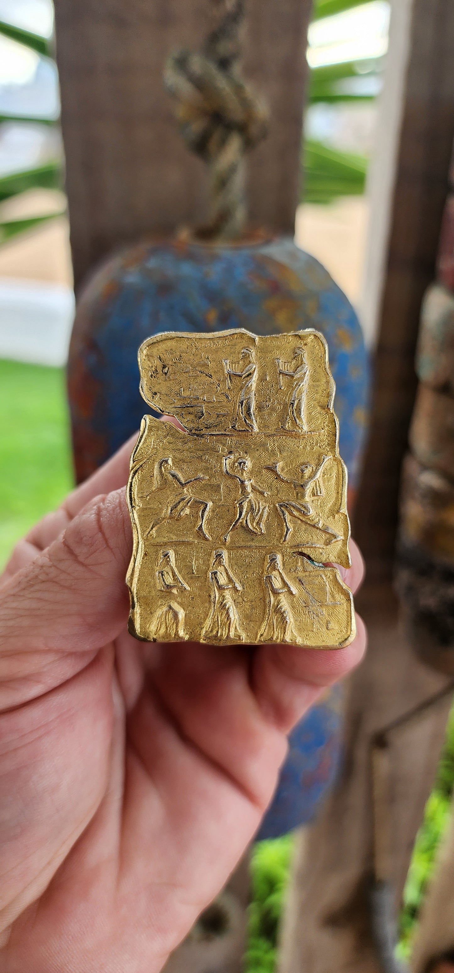 This is a striking vintage gold-tone costume brooch with a bold, ancient-inspired aesthetic. The brooch has an irregular, tablet-like shape, reminiscent of an archaeological artifact or an ancient carved relief.