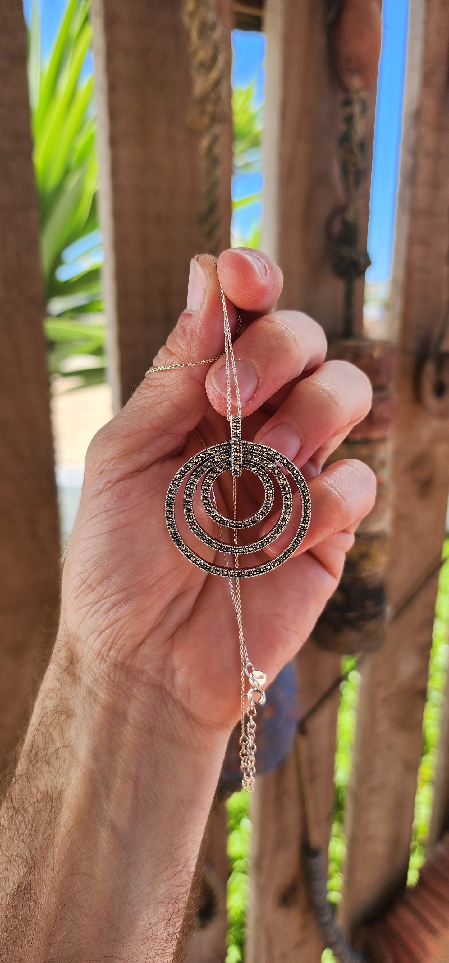 This pendant is pure glam with a modern twist — a total showstopper for lovers of bold geometry and old-school sparkle!