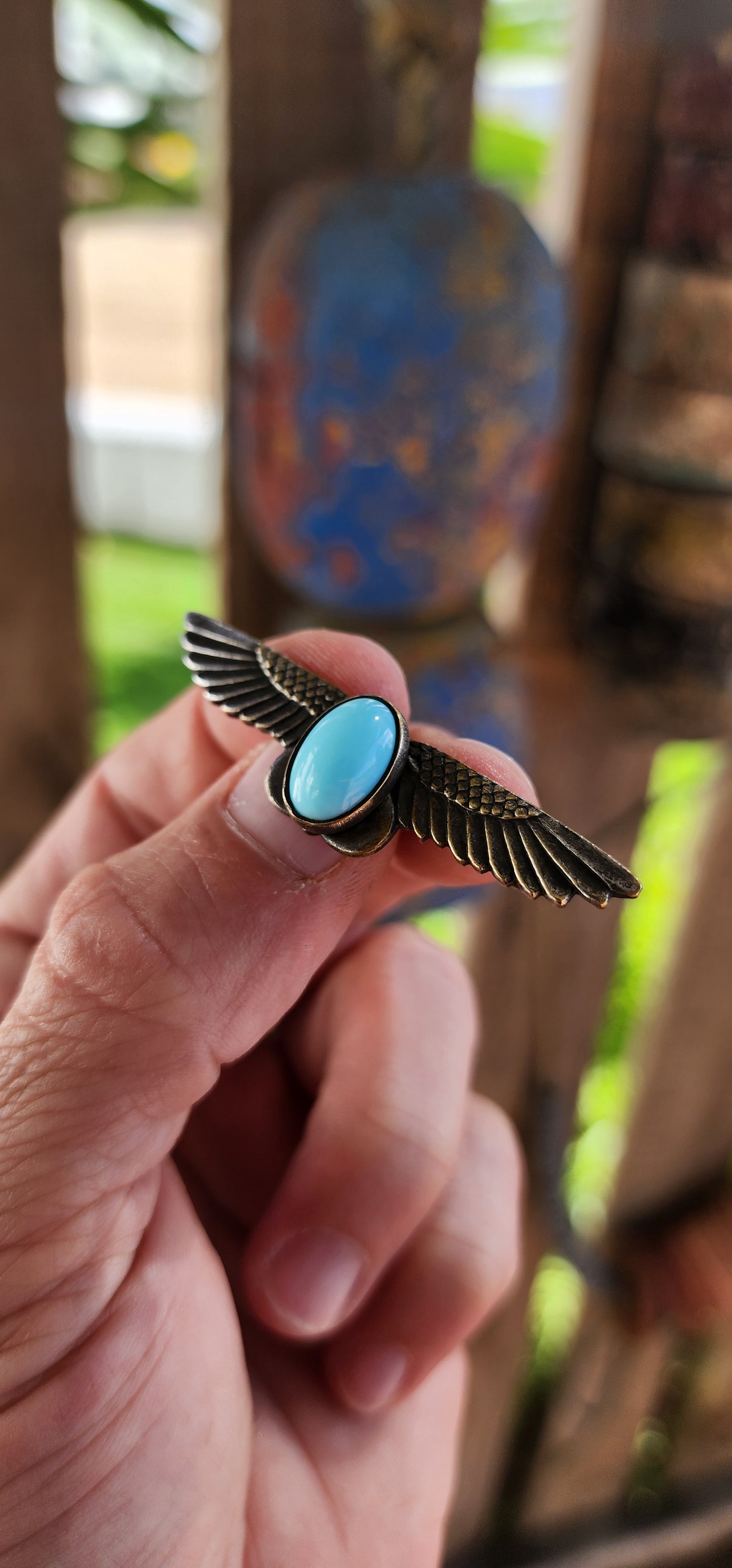 This beautifully crafted brooch is a striking example of Art Deco-era Egyptian Revival jewelry, dating from the 1920s to early 1930s.