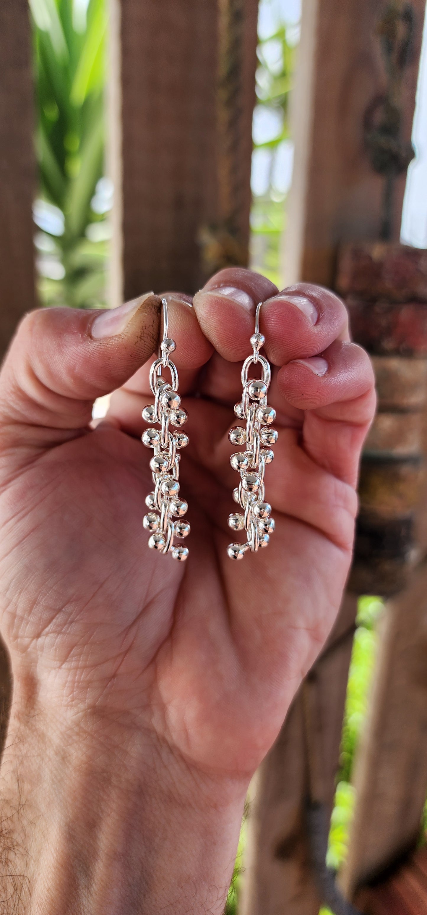 These striking contemporary sterling silver earrings are a masterclass in movement and modern design. Inspired by the elegant twist of a DNA double helix.