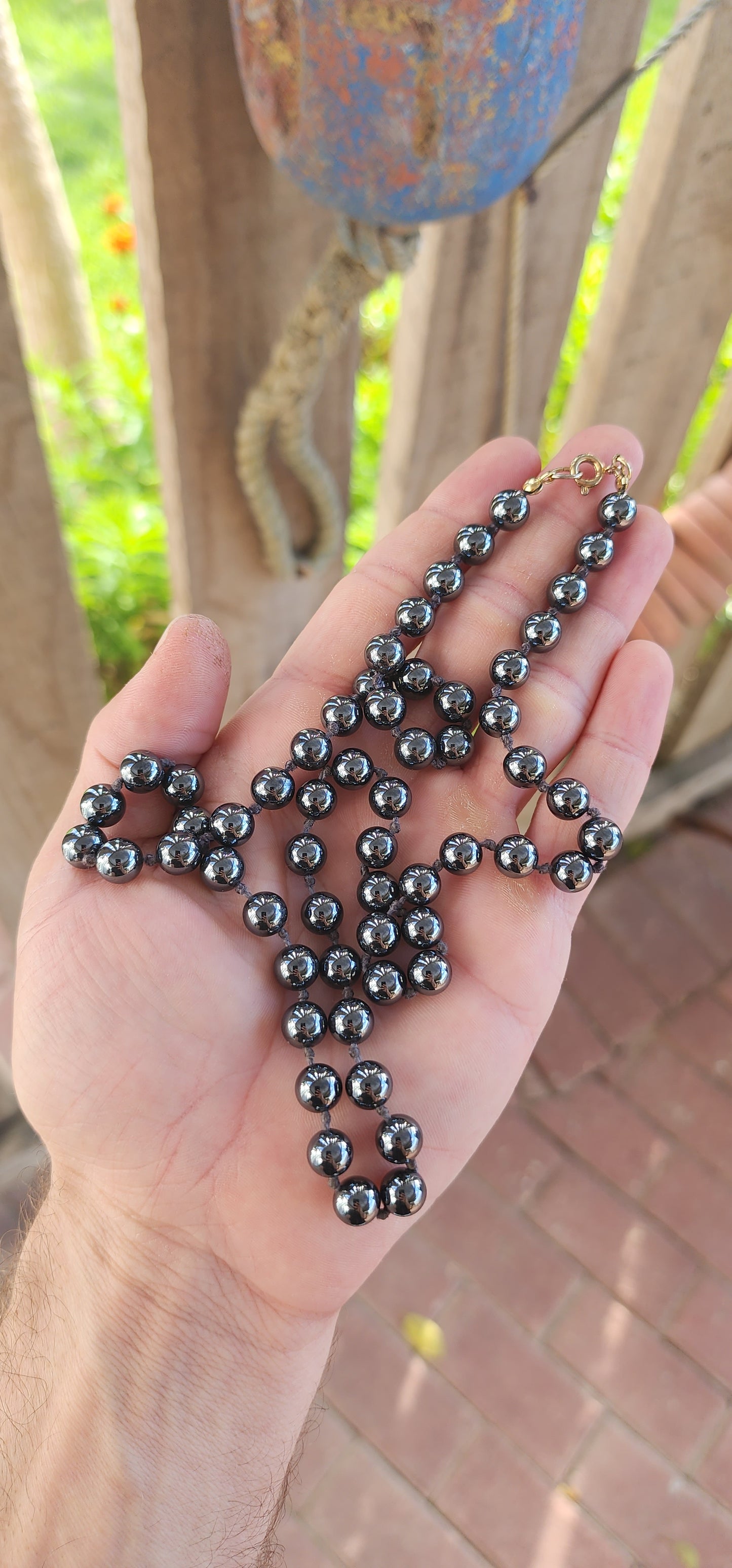 This necklace is giving vintage mystery with a touch of rockstar cool. Extra long, sultry strand of glossy hematite gemstone beads—perfectly round, highly polished, and dark as a midnight mirror.