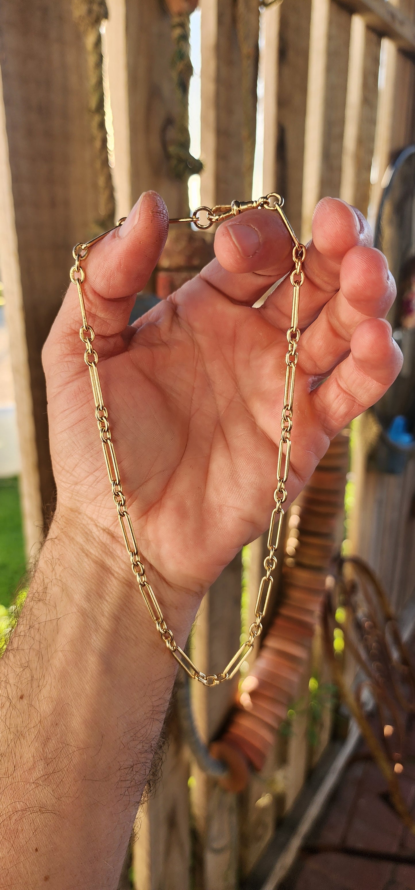 Say hello to a slice of wearable history — a fabulous antique fob chain that marries timeless sophistication with unmistakable golden swagger.This striking beauty is composed entirely of solid 18ct buttery yellow gold.