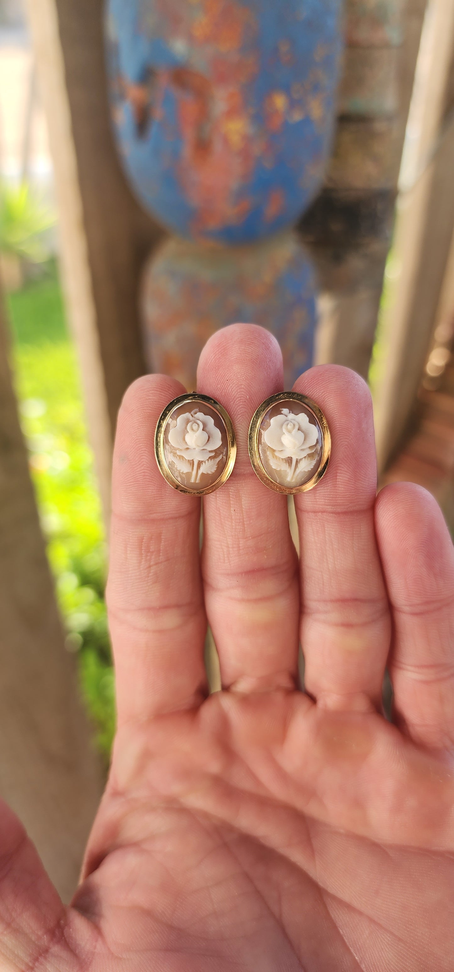 An Exquisite Pair of Mid-Century Carved Conch Shell Cameo Earrings, Circa 1950s.
These enchanting vintage earrings radiate timeless elegance, meticulously handcrafted during the mid-20th century and set in luxurious 14ct yellow gold.