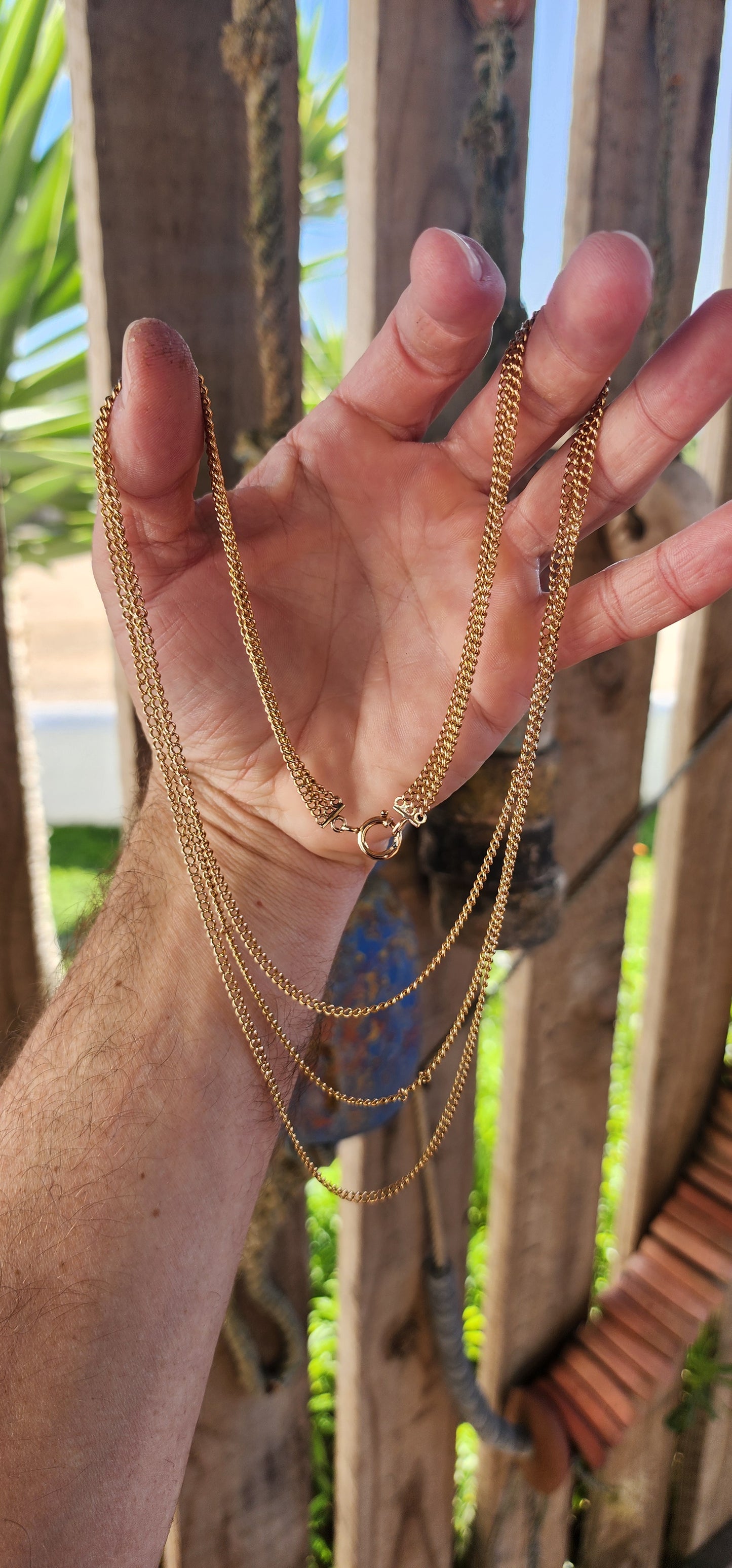 Behold this spectacular antique late Victorian-era 14ct yellow gold three-strand curb link chain necklace—a piece that whispers tales of timeless elegance and genteel grandeur.