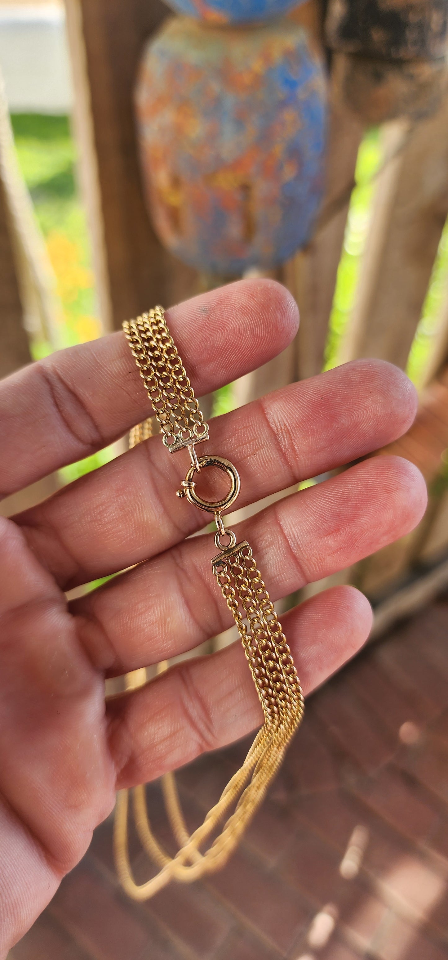 Behold this spectacular antique late Victorian-era 14ct yellow gold three-strand curb link chain necklace—a piece that whispers tales of timeless elegance and genteel grandeur.