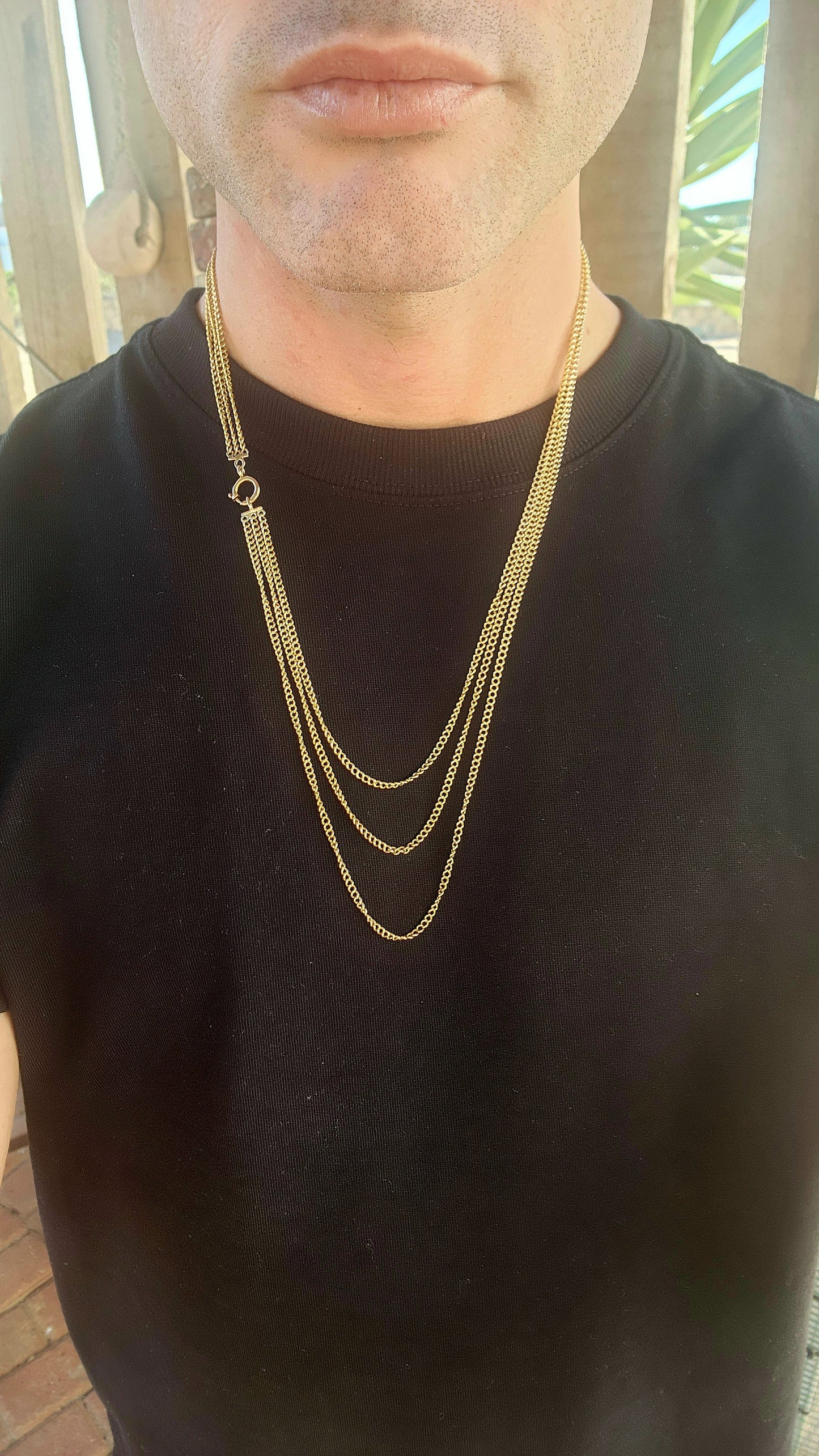 Behold this spectacular antique late Victorian-era 14ct yellow gold three-strand curb link chain necklace—a piece that whispers tales of timeless elegance and genteel grandeur.