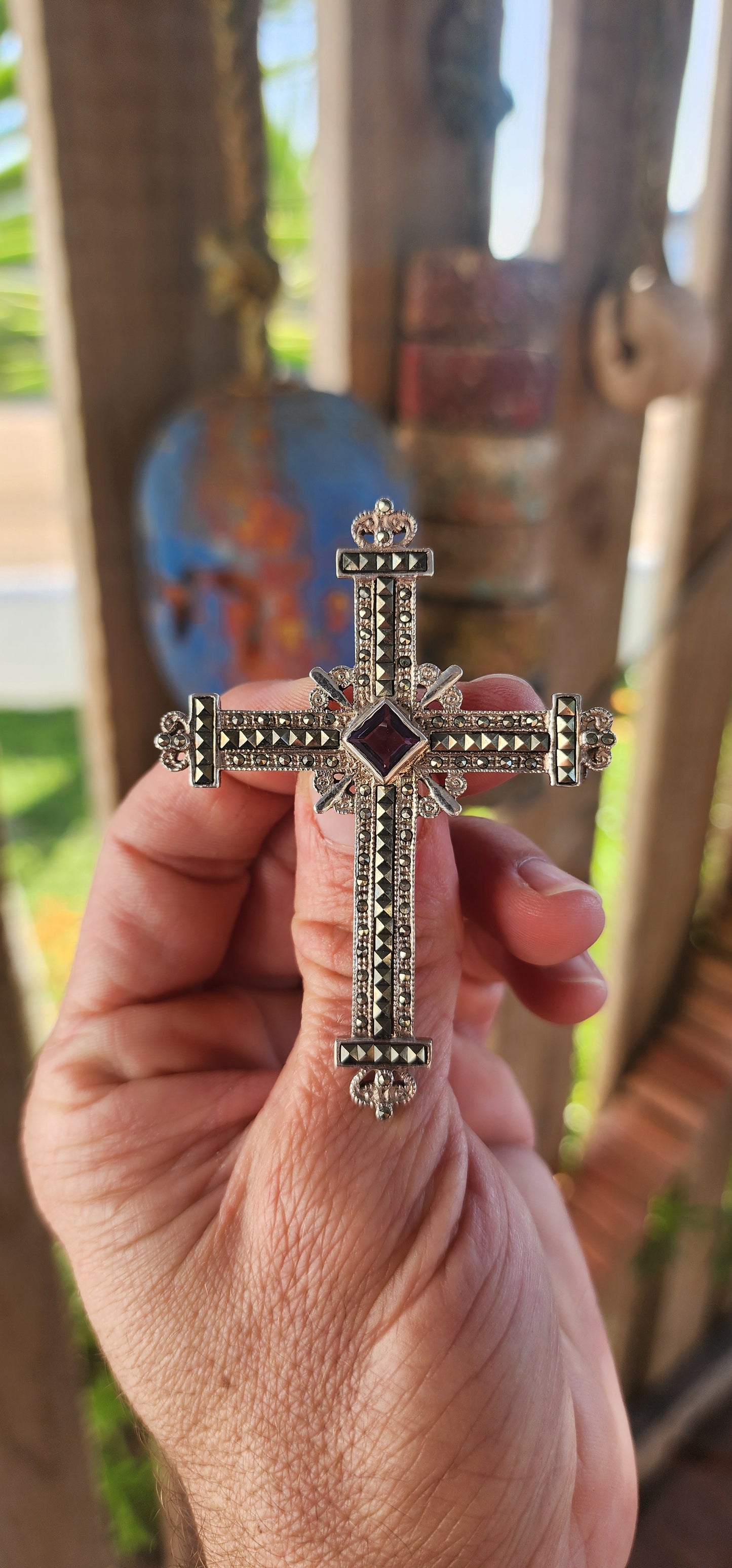 Fit for the breastplate of a crusader prince or the cloak of a baroque queen, this magnificent sterling silver cross brooch-pendant is nothing short of spectacular.