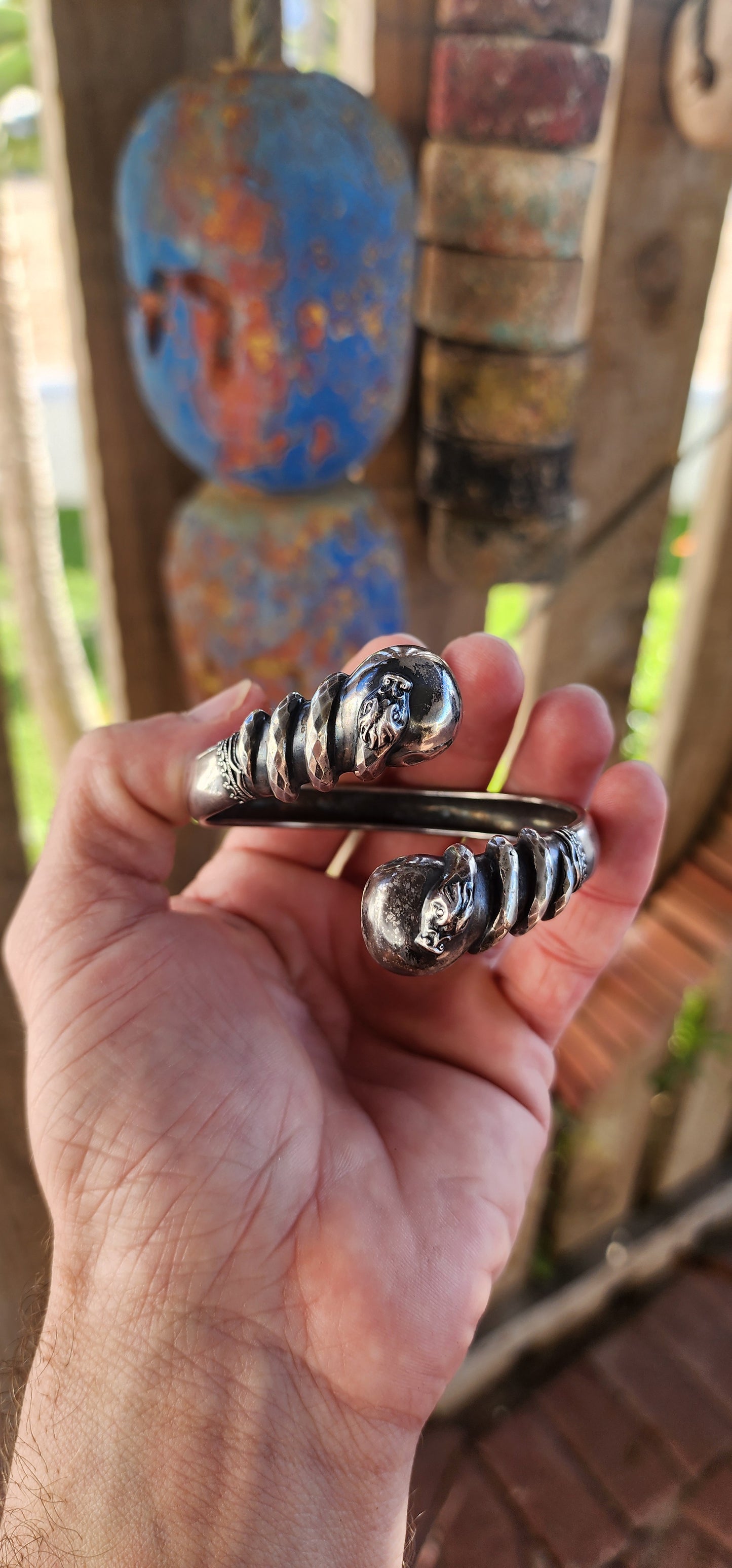 Antique Victorian-Era Etruscan Revival Double Coiled Serpent Cuff Bangle in 800 Silver.
A bold echo of ancient mystery and Victorian imagination, this antique double-headed serpent cuff bangle is a striking example of Etruscan Revival artistry in silver.