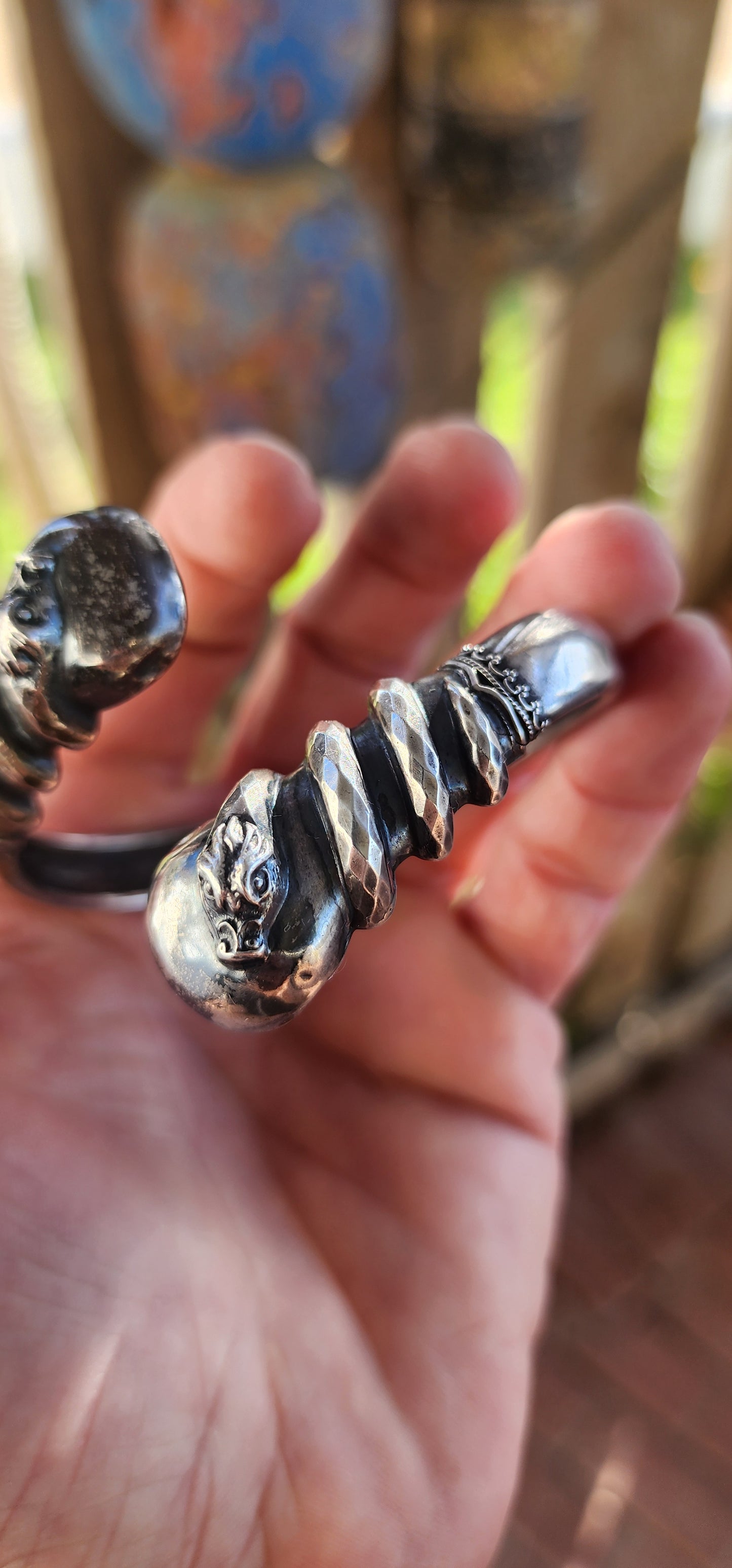 Antique Victorian-Era Etruscan Revival Double Coiled Serpent Cuff Bangle in 800 Silver.
A bold echo of ancient mystery and Victorian imagination, this antique double-headed serpent cuff bangle is a striking example of Etruscan Revival artistry in silver.