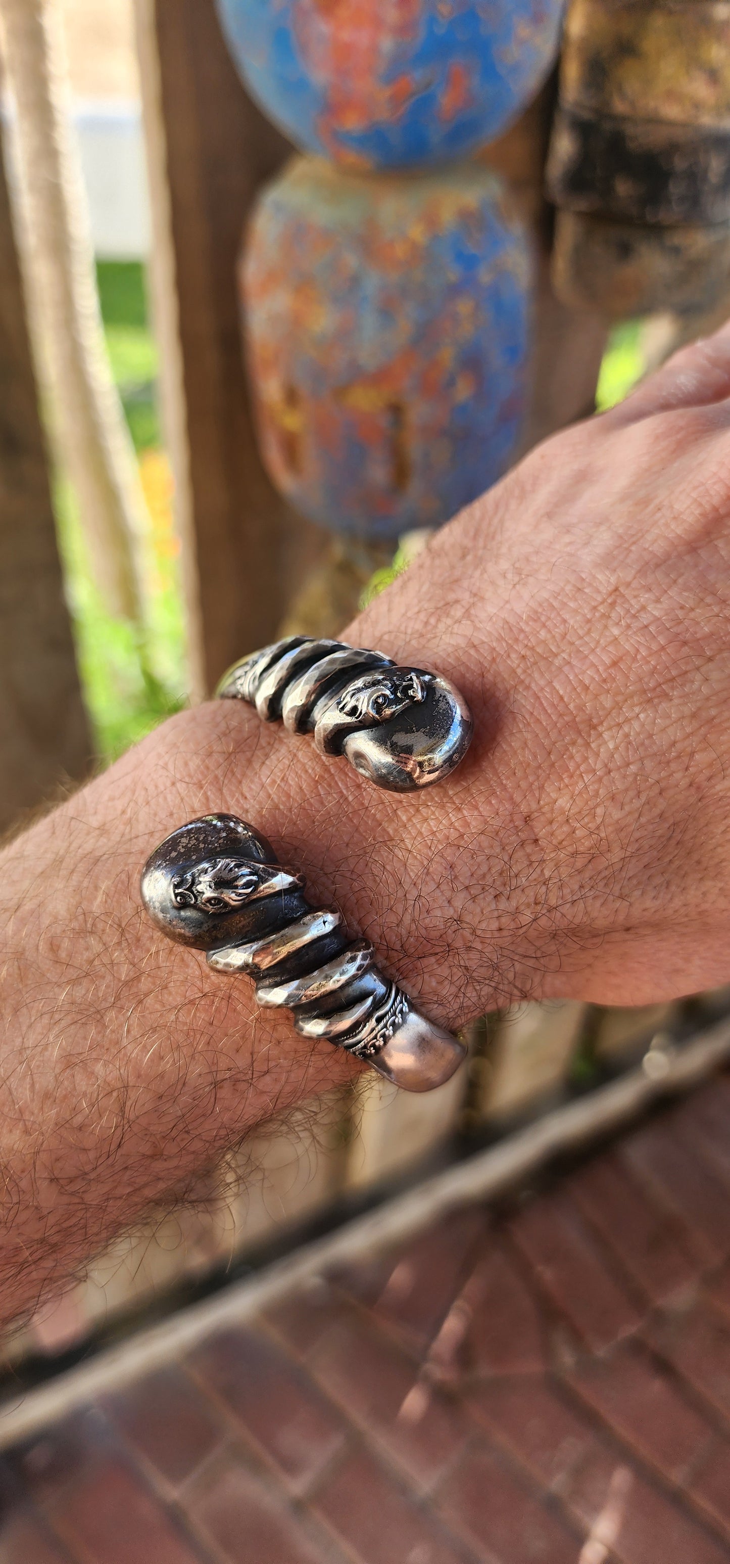 Antique Victorian-Era Etruscan Revival Double Coiled Serpent Cuff Bangle in 800 Silver.
A bold echo of ancient mystery and Victorian imagination, this antique double-headed serpent cuff bangle is a striking example of Etruscan Revival artistry in silver.