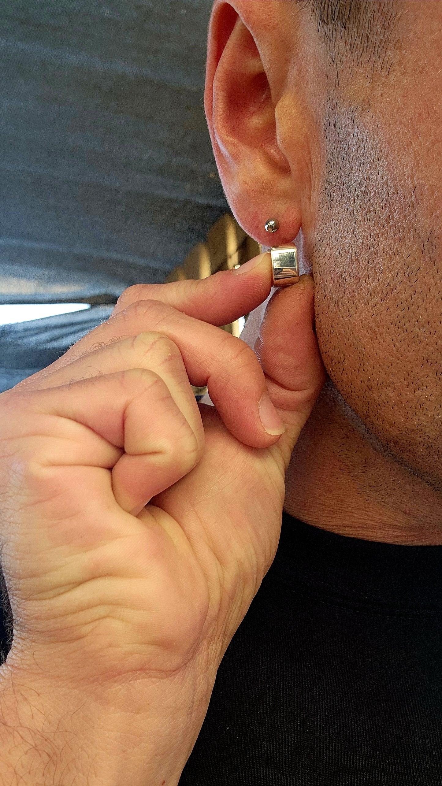 These sterling silver huggie earrings are a masterclass in modern minimalism, sculpted in a bold rounded-rectangular shape that hugs the ear with contemporary charm.