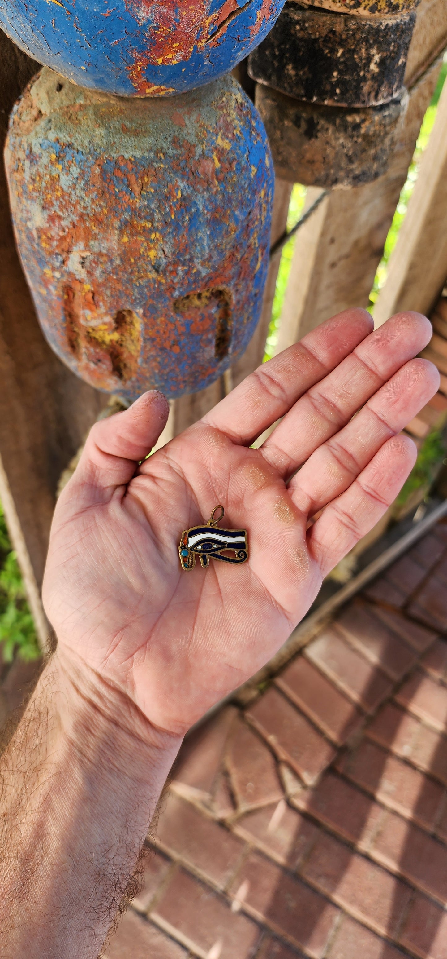 Behold—an amulet fit for a Pharaoh's neck or a modern-day adventurer channeling divine protection! This striking antique pendant is a radiant artifact from the Art Deco era, when the world fell under the spell of Egyptian Revival.