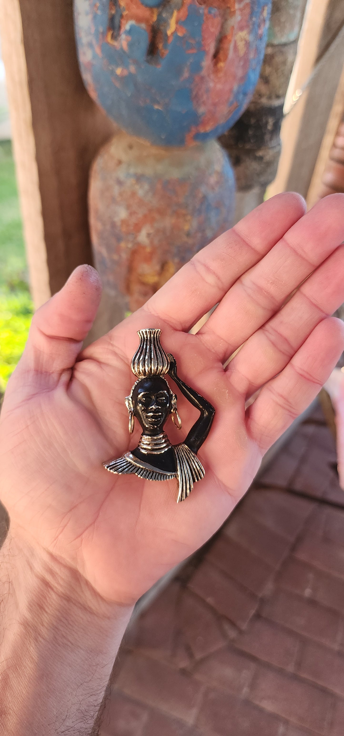 This 1950/60s mid-century costume brooch is all about bold storytelling, cultural homage, and theatrical flair! Crafted in goldtone brass with hand-applied cold-painted black enamel, this figural masterpiece depicts a poised Nubian water carrier.