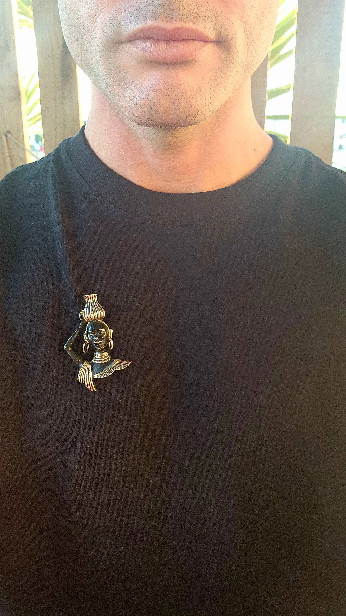 This 1950/60s mid-century costume brooch is all about bold storytelling, cultural homage, and theatrical flair! Crafted in goldtone brass with hand-applied cold-painted black enamel, this figural masterpiece depicts a poised Nubian water carrier.
