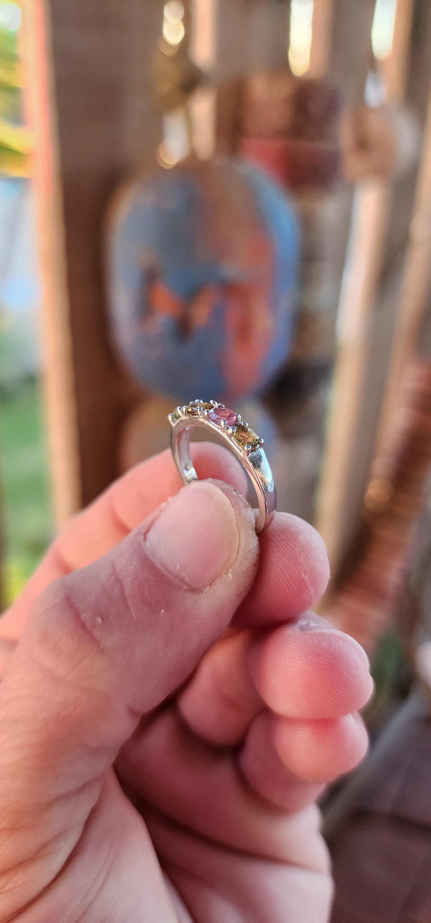 Let your fingers tell a story of color and wonder with this enchanting sterling silver half-eternity ring. Prong-set along the polished silver band are four oval-cut multi-colored tourmalines, each a glowing whisper of nature’s palette.