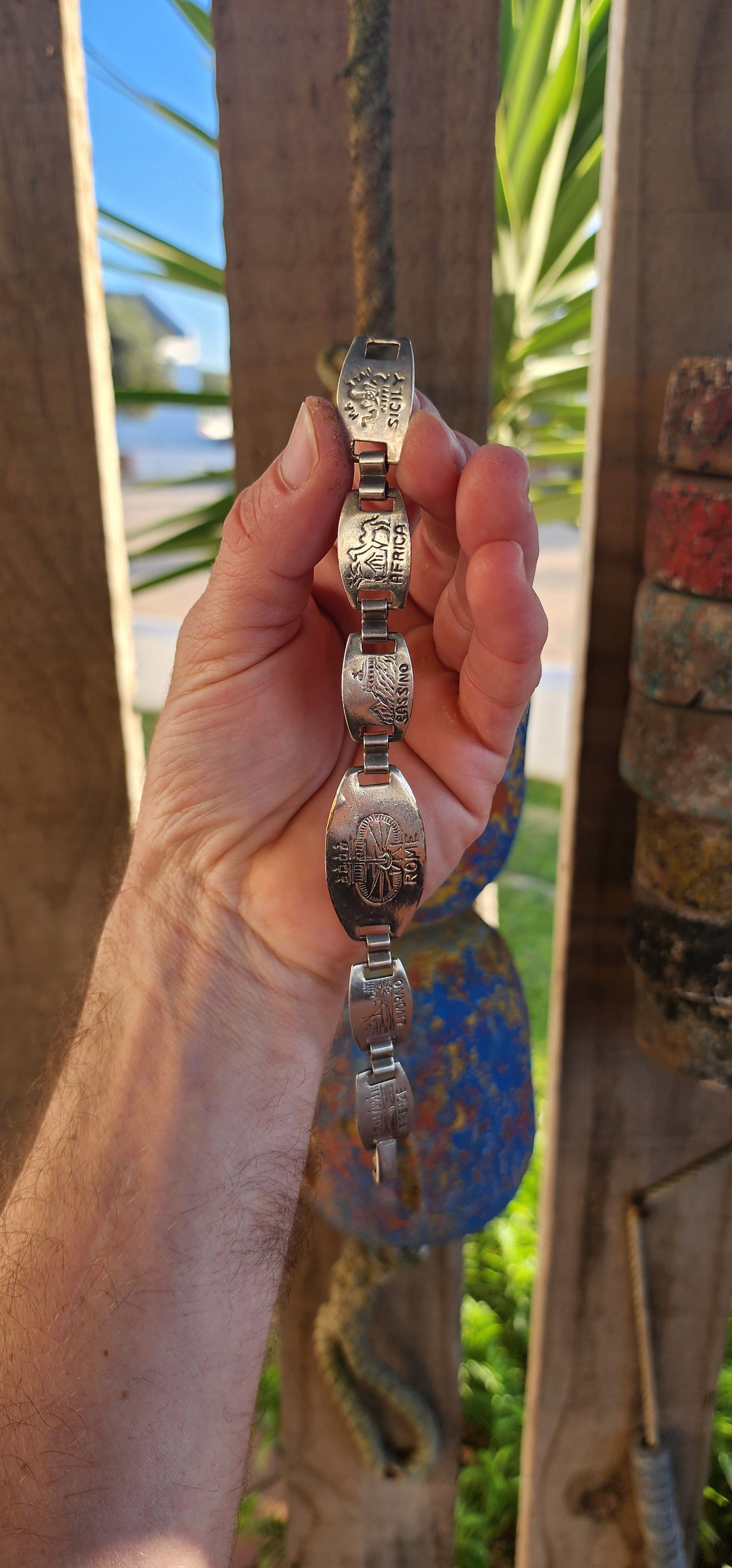 Jet-set glamour meets nostalgic charm in this vintage panel bracelet by iconic French jewelry house Gas Bijoux. This beauty is silver-plated and handcrafted in the distinctive style of WWII-era Italian souvenir bracelets.