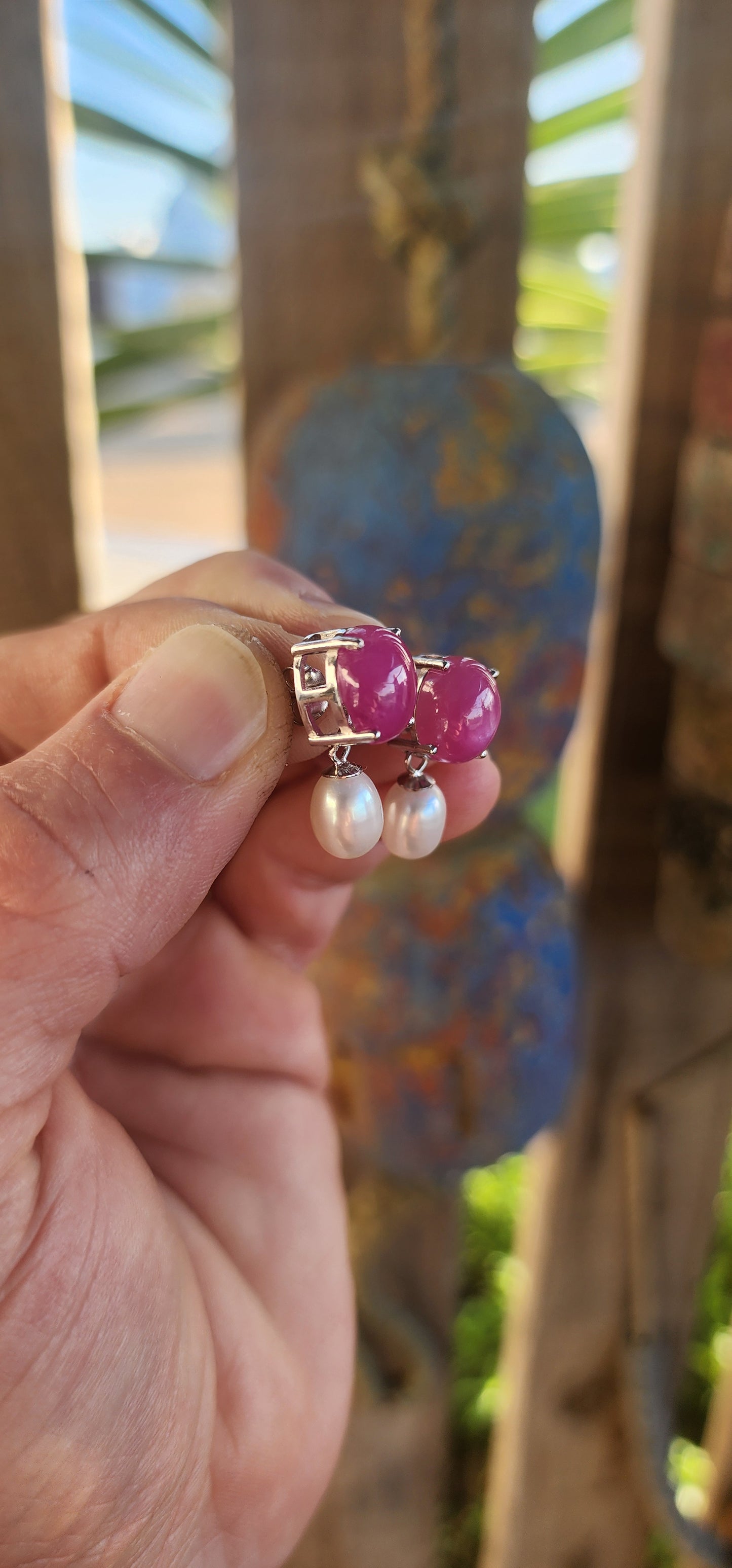 Dramatic yet delicate, these earrings are like love letters from two different worlds—where the fiery charm of rubies meets the soft whisper of pearls in perfect harmony.