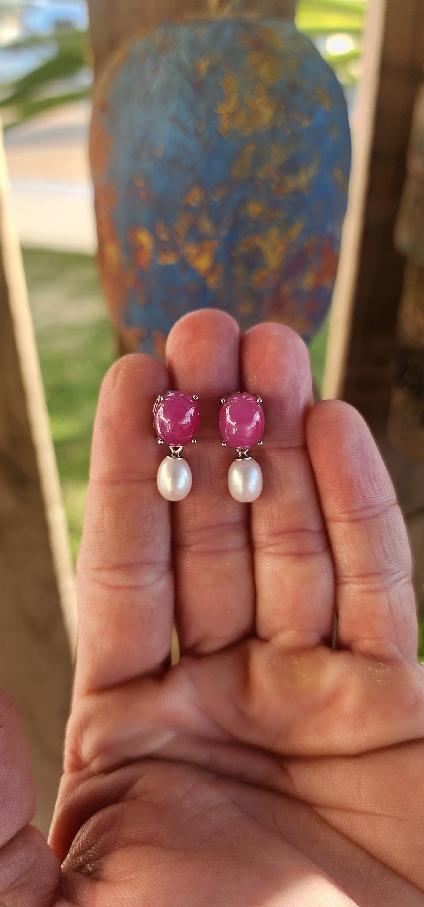 Dramatic yet delicate, these earrings are like love letters from two different worlds—where the fiery charm of rubies meets the soft whisper of pearls in perfect harmony.