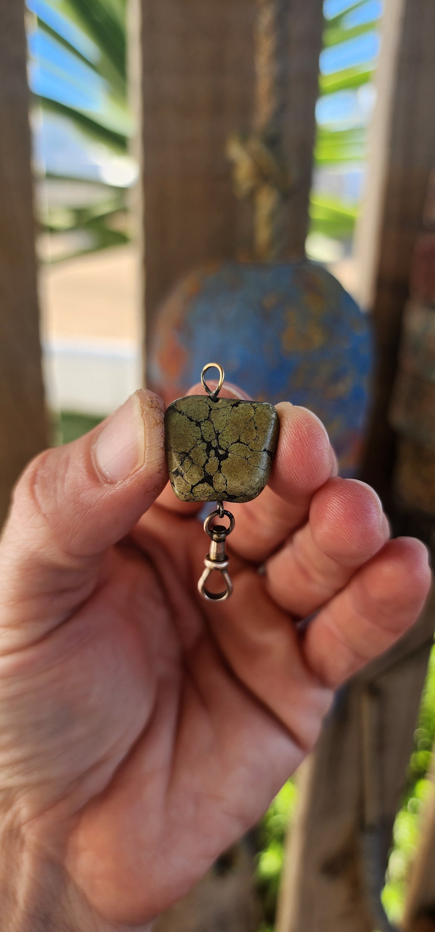 This antique fob pendant is a pocket-sized keepsake of Victorian ingenuity and charm, brought to life with a soul-stirring gem from the heart of the earth.