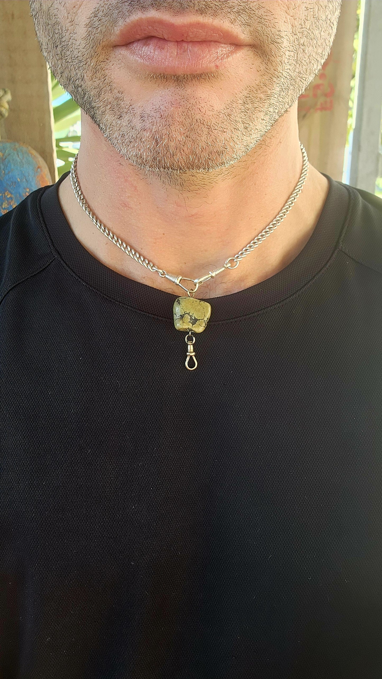 This antique fob pendant is a pocket-sized keepsake of Victorian ingenuity and charm, brought to life with a soul-stirring gem from the heart of the earth.