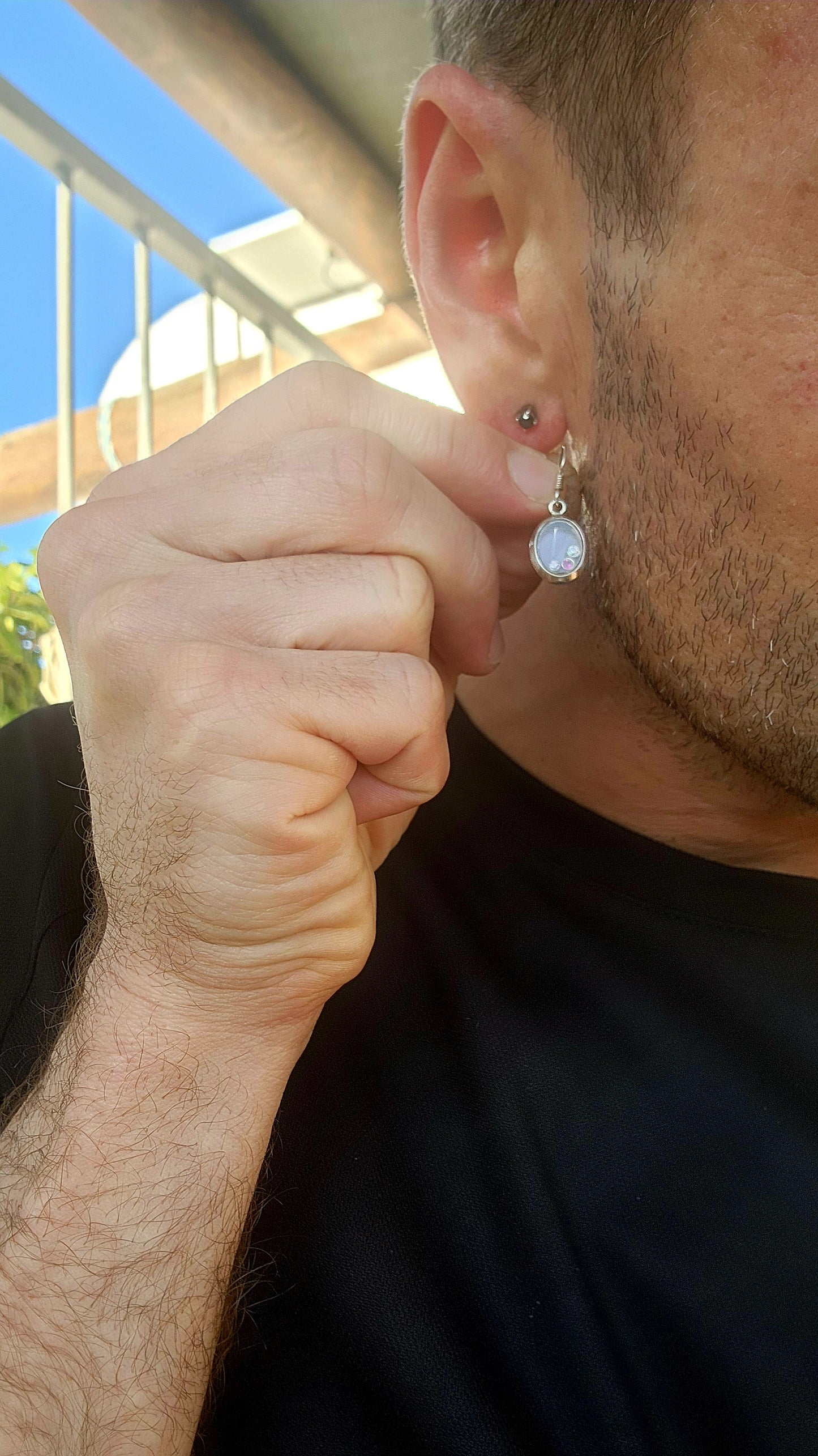 Ready to add a dash of whimsy to your lobes? These charming sterling silver drop earrings are like miniature curiosity cabinets for your ears — each one an oval-shaped porthole with a secret sparkling surprise inside.