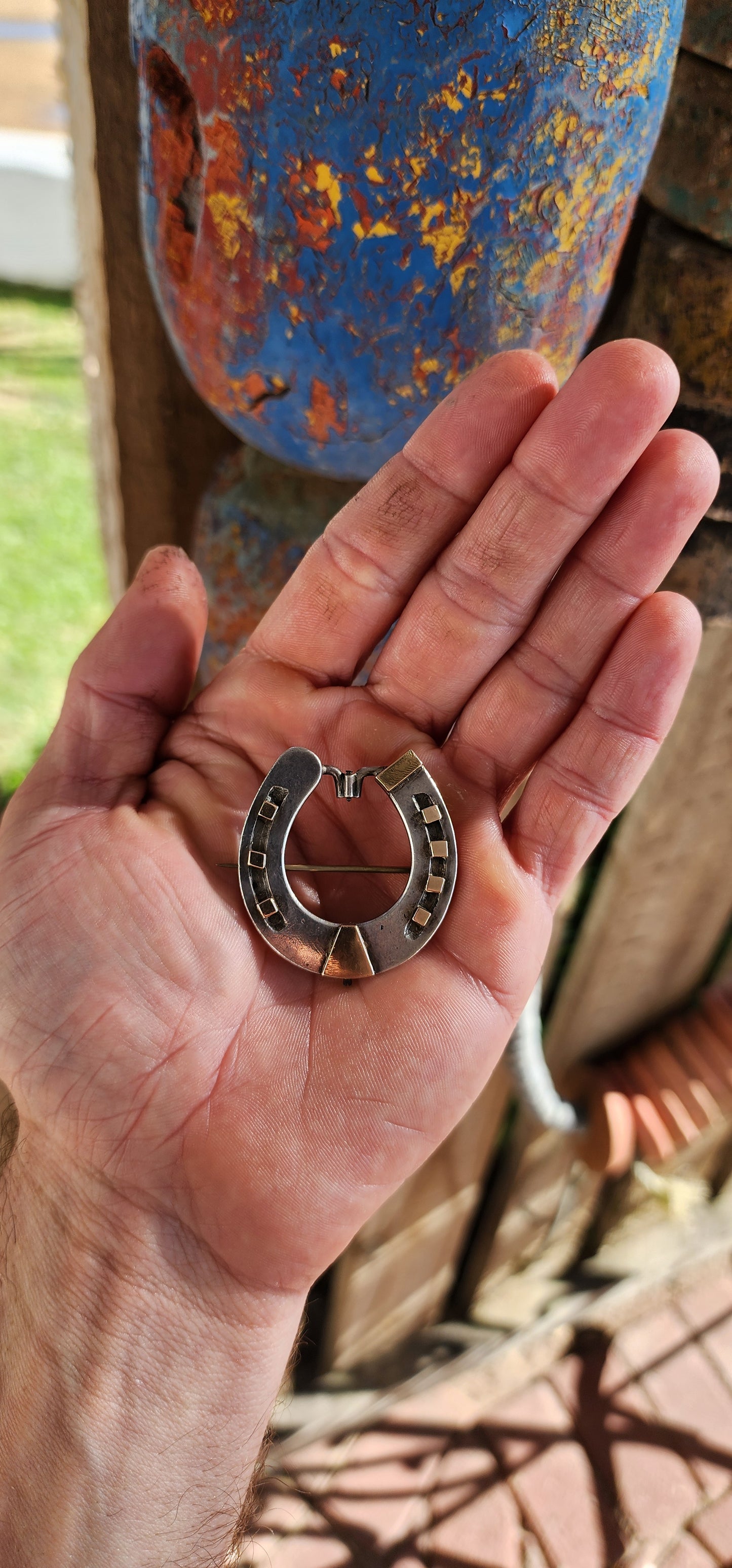 Rare and commanding Victorian era lucky horseshoe brooch, masterfully crafted in solid sterling silver and adorned with 9ct rose gold accents. Measuring large and weighty, this brooch doesn’t whisper luck—it proclaims it.