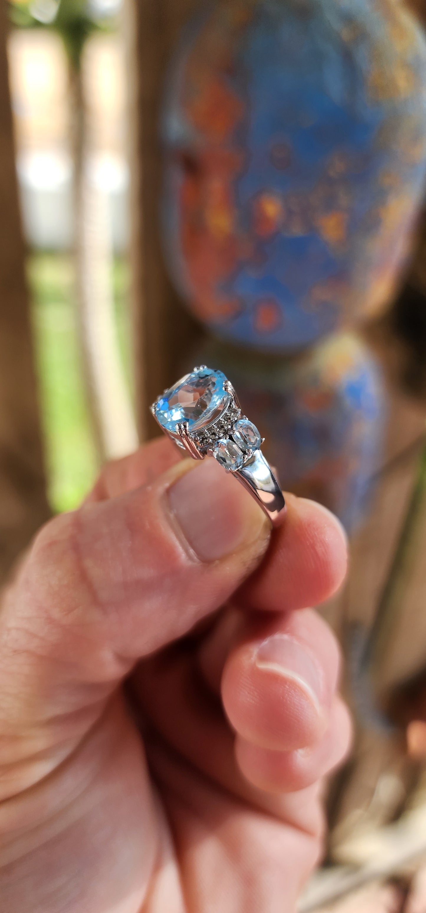 "Cloudlight Crown" – A Ring of Sky and Sparkle
Like a breath of fresh air in jewelry form, this marvelous, rather chunky trilogy-style ring is expertly crafted in rhodium-plated sterling silver, ensuring it keeps its high-polish shine.