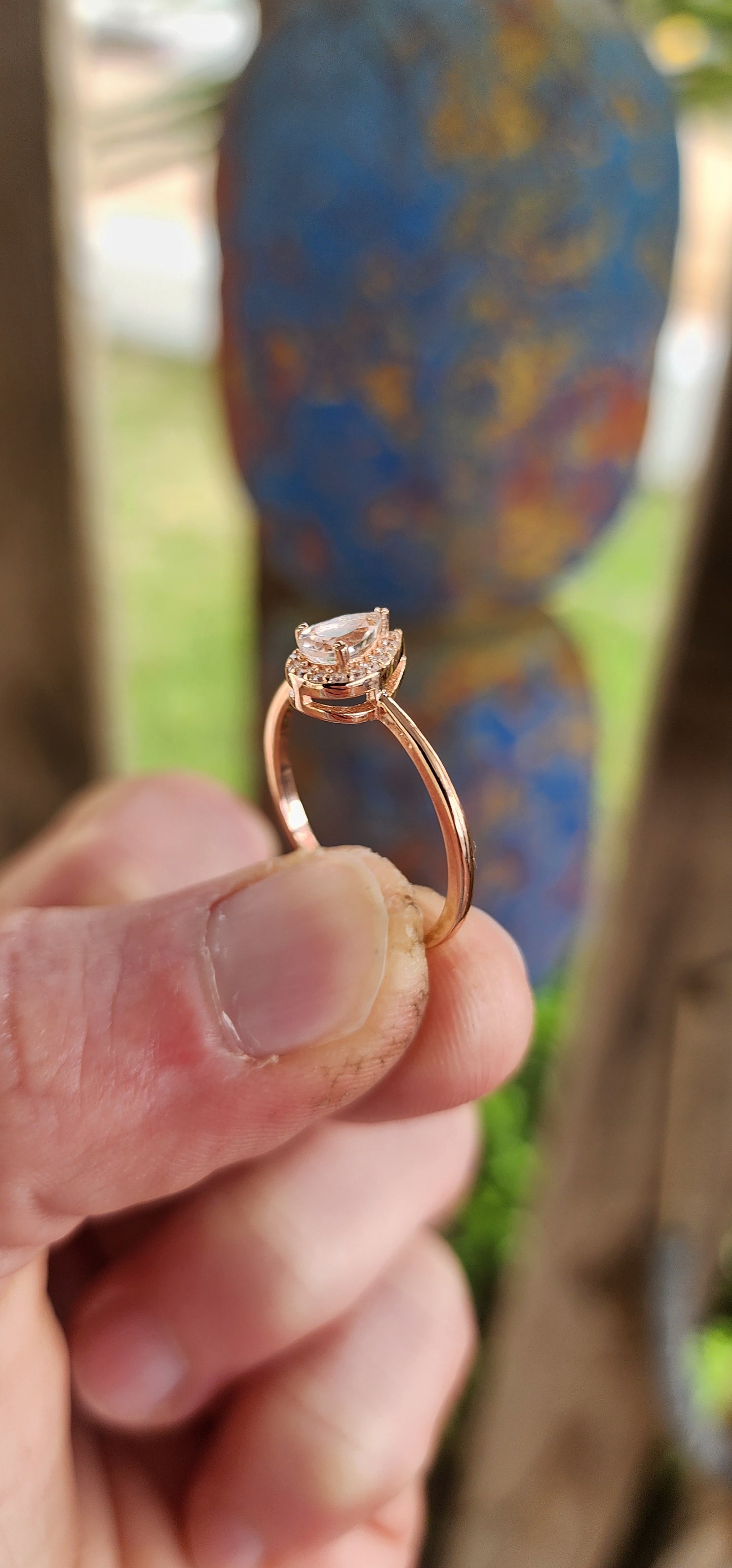 As delicate as the morning's first kiss of sunlight, this enchanting ring is a love letter in rose gold over sterling silver . Nestled at its heart is a pear-cut morganite gemstone, glowing softly like a drop of blushing dew caught at dawn.