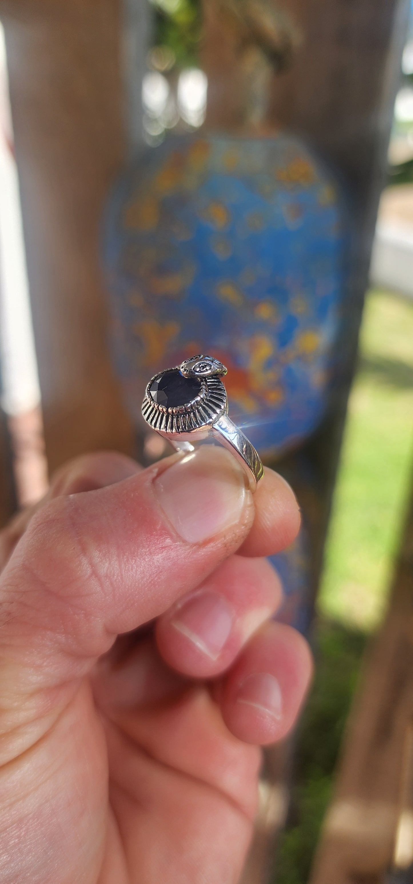 "Whispers of the Sapphire Serpent"
This sterling silver ring is like a mysterious legend coiled delicately around your finger! At its heart sits a deep blue oval-cut sapphire, faceted to perfection, glowing like a hidden midnight lake under a starlit sky.