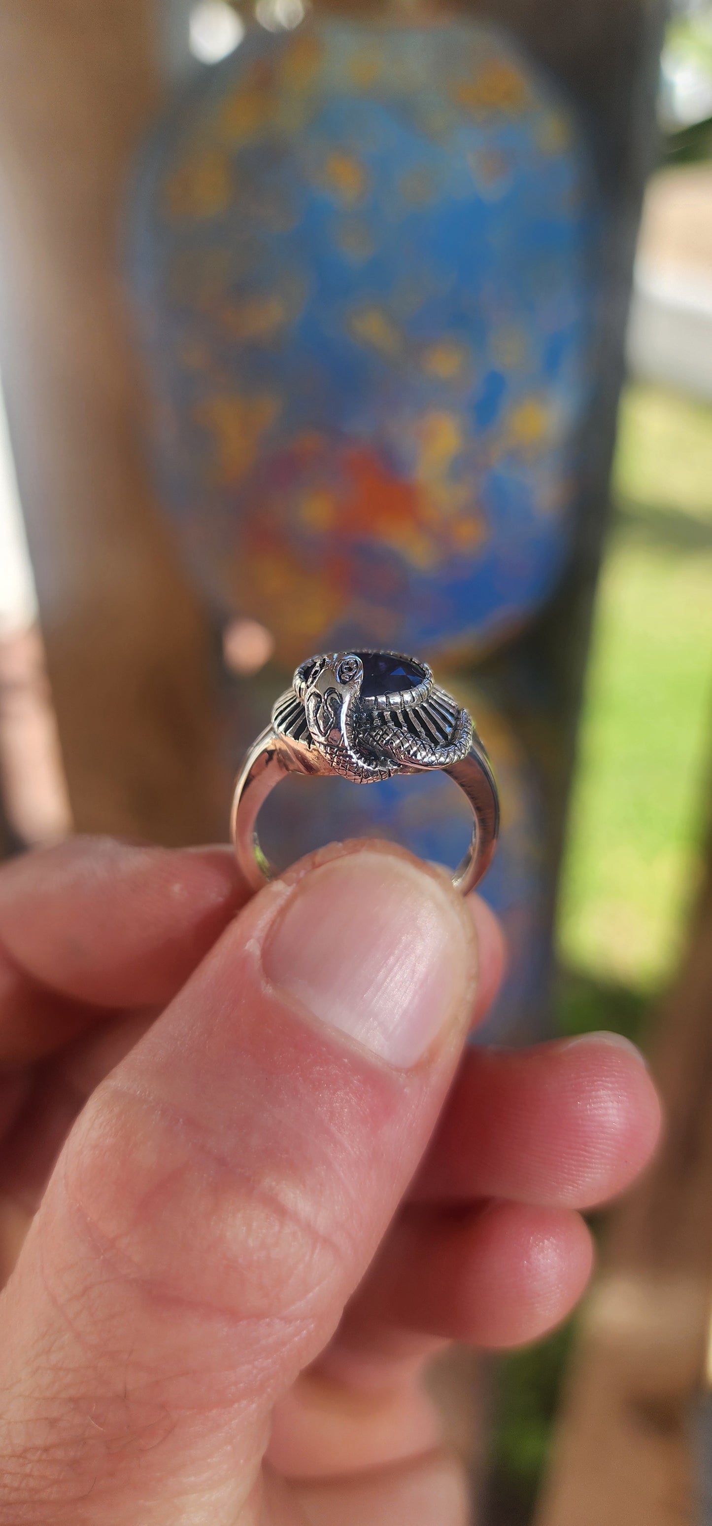 "Whispers of the Sapphire Serpent"
This sterling silver ring is like a mysterious legend coiled delicately around your finger! At its heart sits a deep blue oval-cut sapphire, faceted to perfection, glowing like a hidden midnight lake under a starlit sky.