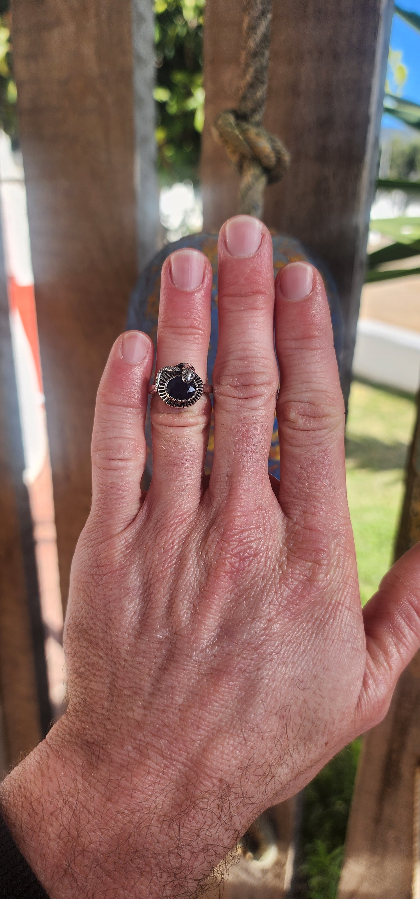 "Whispers of the Sapphire Serpent"
This sterling silver ring is like a mysterious legend coiled delicately around your finger! At its heart sits a deep blue oval-cut sapphire, faceted to perfection, glowing like a hidden midnight lake under a starlit sky.